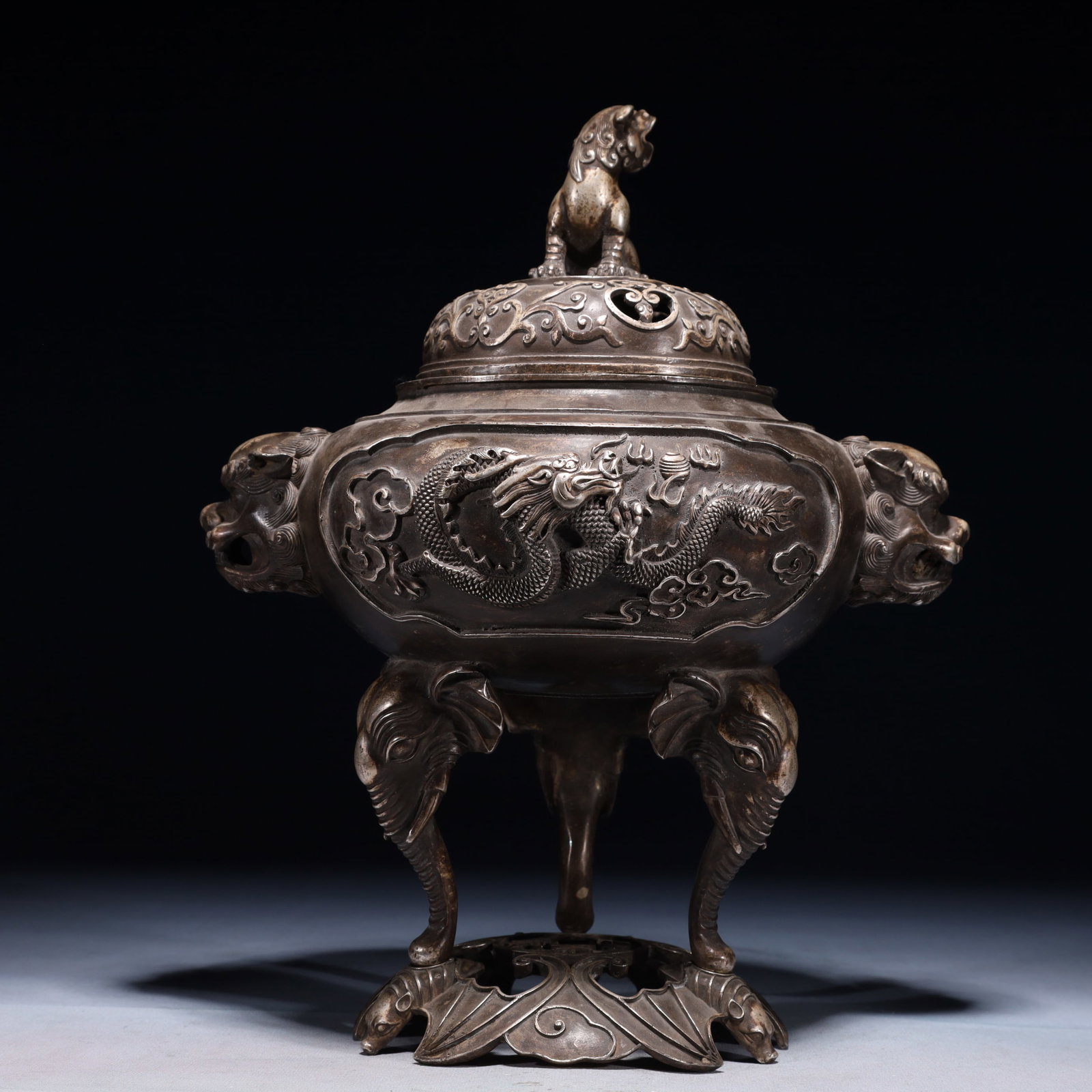 An Exquisite Silver-plated Bronze Auspicious Cloud and Dragon Pattern Beast-Ears Tripod Censer: An Exquisite Silver-plated Bronze Auspicious Cloud and Dragon Pattern Beast-Ears Tripod Censer,Qing Dynasty,China,Qianlong Six-character Mark,Size:10.6inx7.9inx13in,Weight:3100g