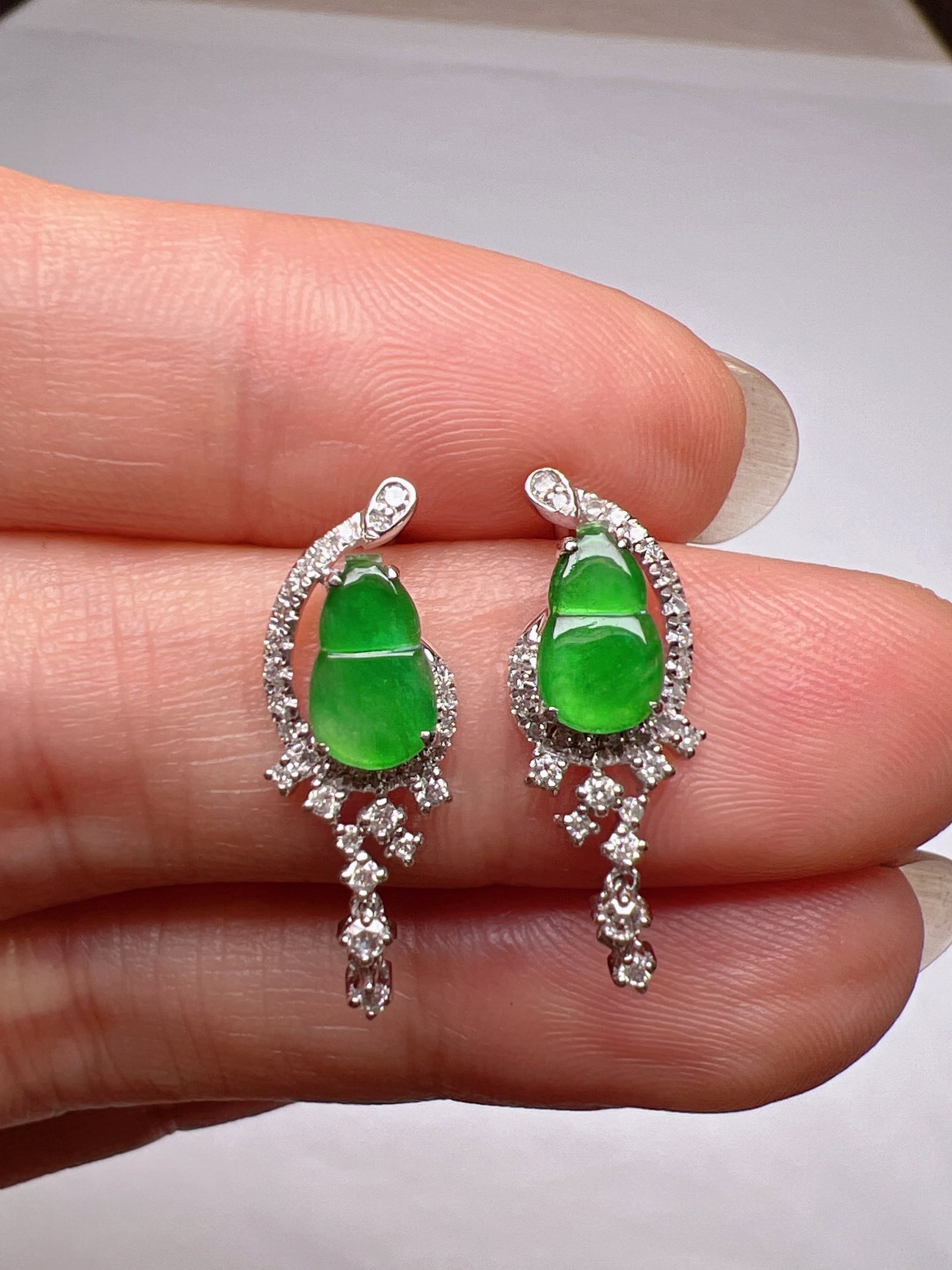 A Pair of Exquisite 18k Gold Diamond Inlaid Jadeite Earrings: A Pair of Exquisite 18k Gold Diamond Inlaid Jadeite Earrings,Size(Loose Stone):0.3inx0.2in 一对18k金钻镶嵌翡翠耳钉