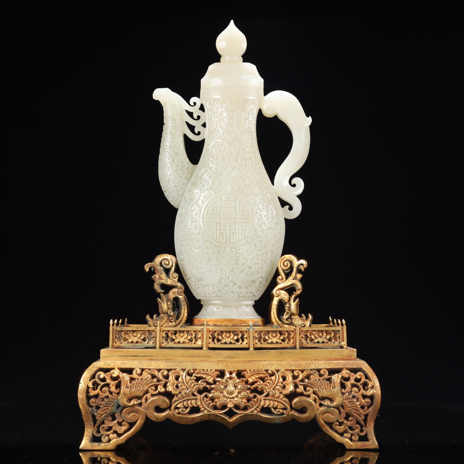 A Rare White Jade Flower Pattern Ewer,With Gilt Bronze Base: A Rare White Jade Flower Pattern Ewer,With Gilt Bronze Base,Qing Dynasty, China,Size:6.7inx2.4inx13in,(Base)11inx6.7inx7.5in,Weight:5350g