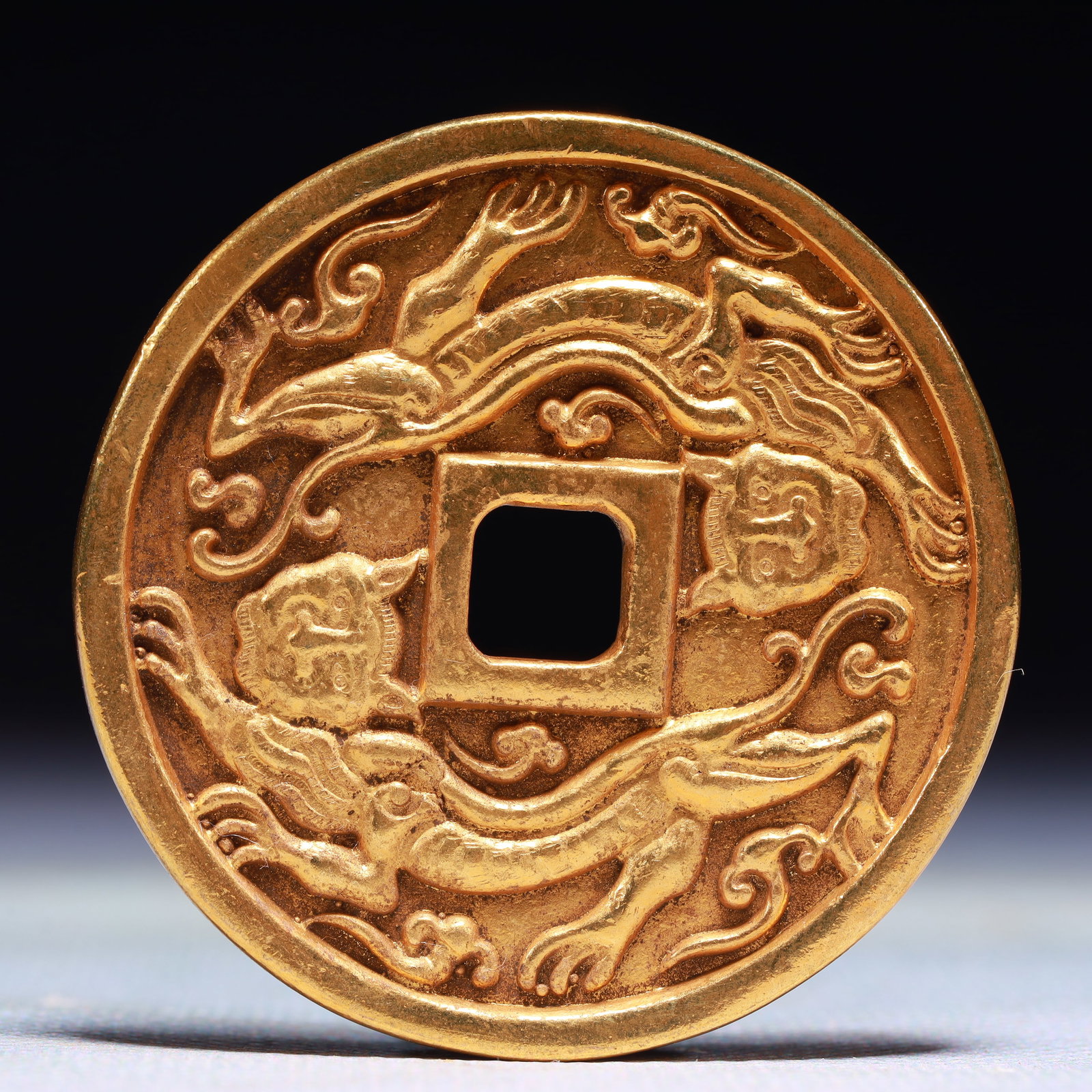 An Exquisite Gilt Bronze Auspicious Beast Pattern Cash Coin: An Exquisite Gilt Bronze Auspicious Beast Pattern Cash Coin,Han Dynasty,China,Size:2in,Weight:38g 铜鎏金瑞兽纹钱币,中国汉代