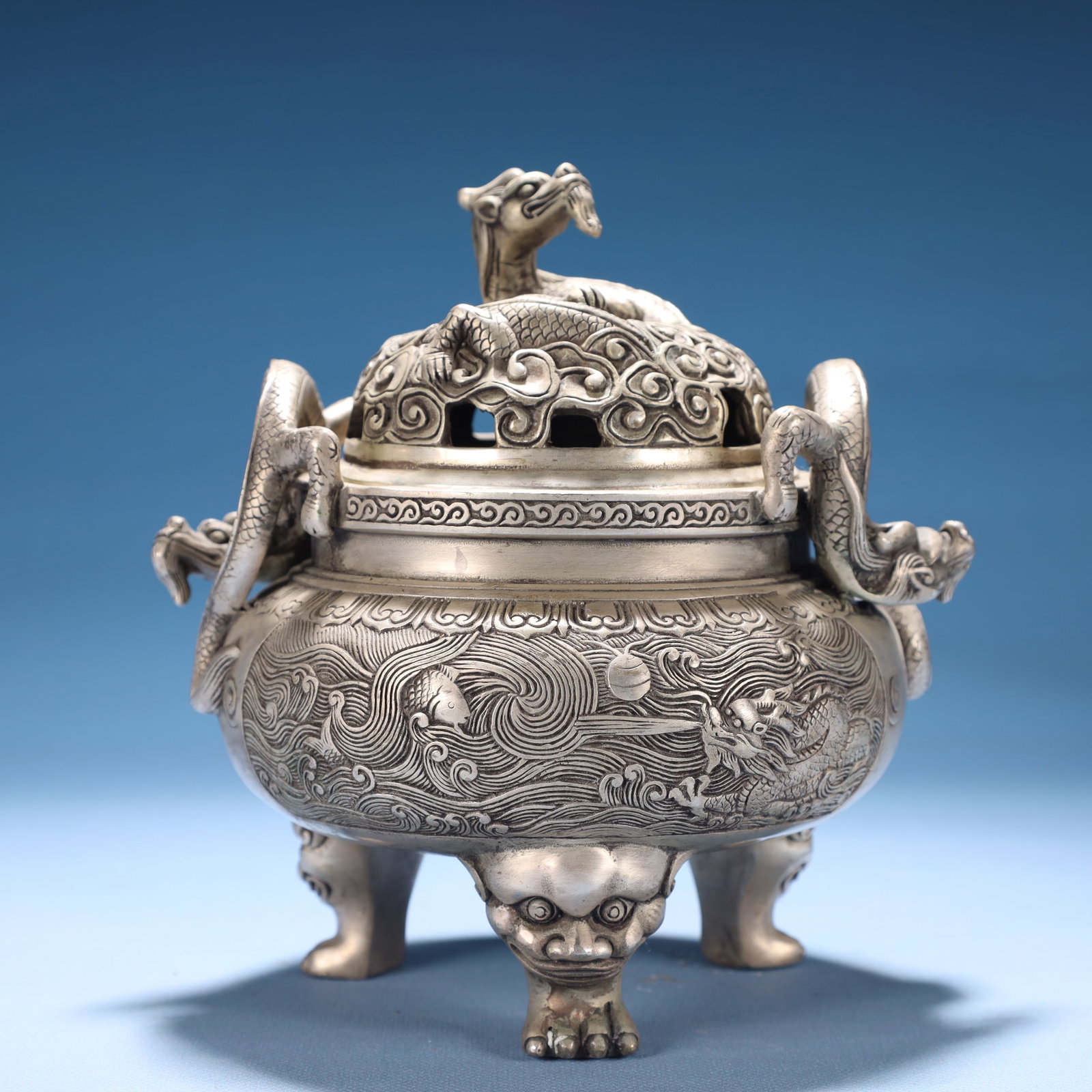 An Exquisite Silver Seawater and Dragon Pattern Double-Ears and Tripod Censer: An Exquisite Silver Seawater and Dragon Pattern Double-Ears and Tripod Censer,Qing Dynasty,China,Qianlong Four-character Mark,Size:6.7inx5.5inx7.5in,Weight:1700g 镀银海水࿵
