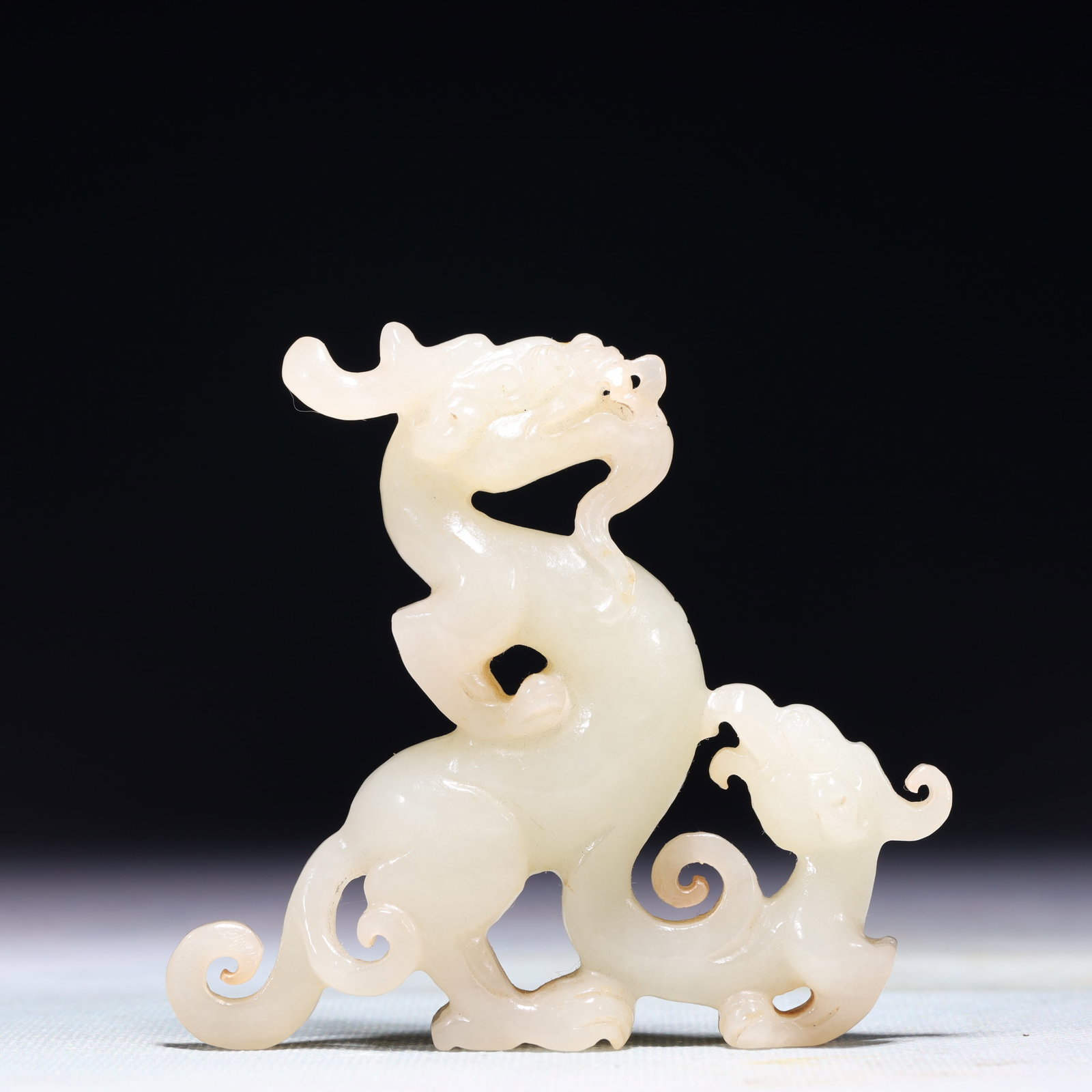 An Exquisite White Jade Dragon and Phoenix Ornament