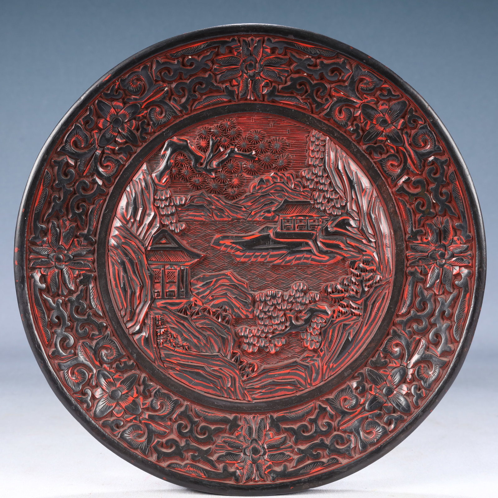 An Exquisite Carved Red Lacquer Landscape and Figure Pattern Plate (1 of 5)