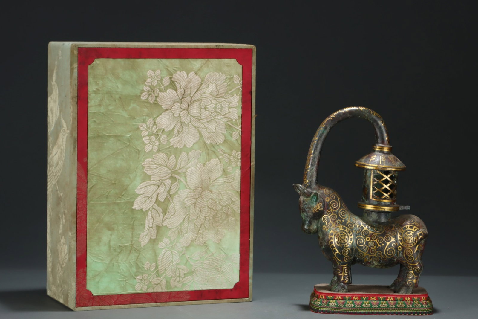An Archaic Bronze Inlaid Gold Buffalo Palace Lantern,With Inscription: An Archaic Bronze Inlaid Gold Buffalo Palace Lantern,With Inscription,the Warring States period in China,Size:11.2inx8in