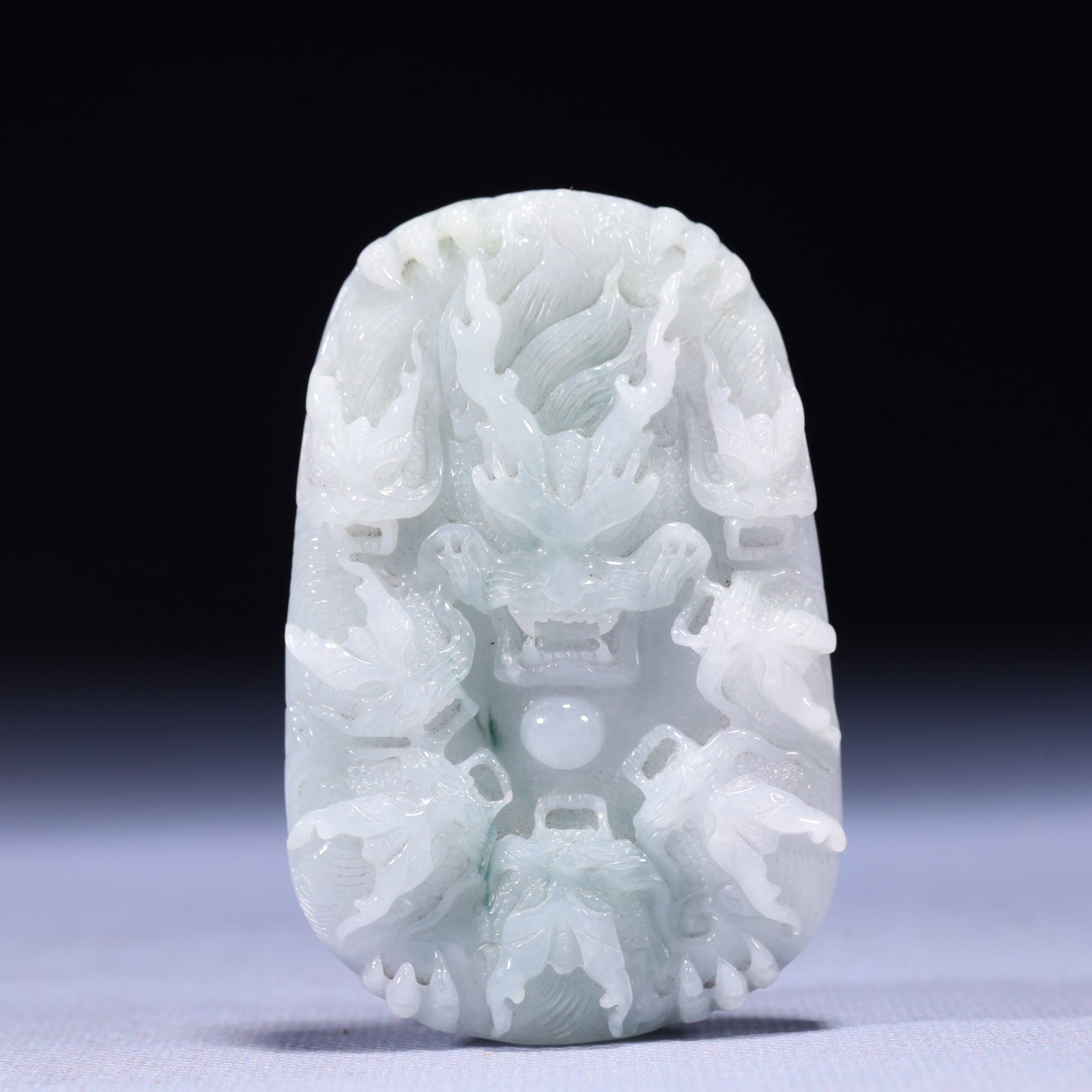 An Exquisite Jadeite Dragon Pattern Pendant: An Exquisite Jadeite Dragon Pattern Pendant,Qing Dynasty,China,Size:1.8inx0.4inx2.8in,Weight:78g 翡翠龙纹挂件,中国清代
