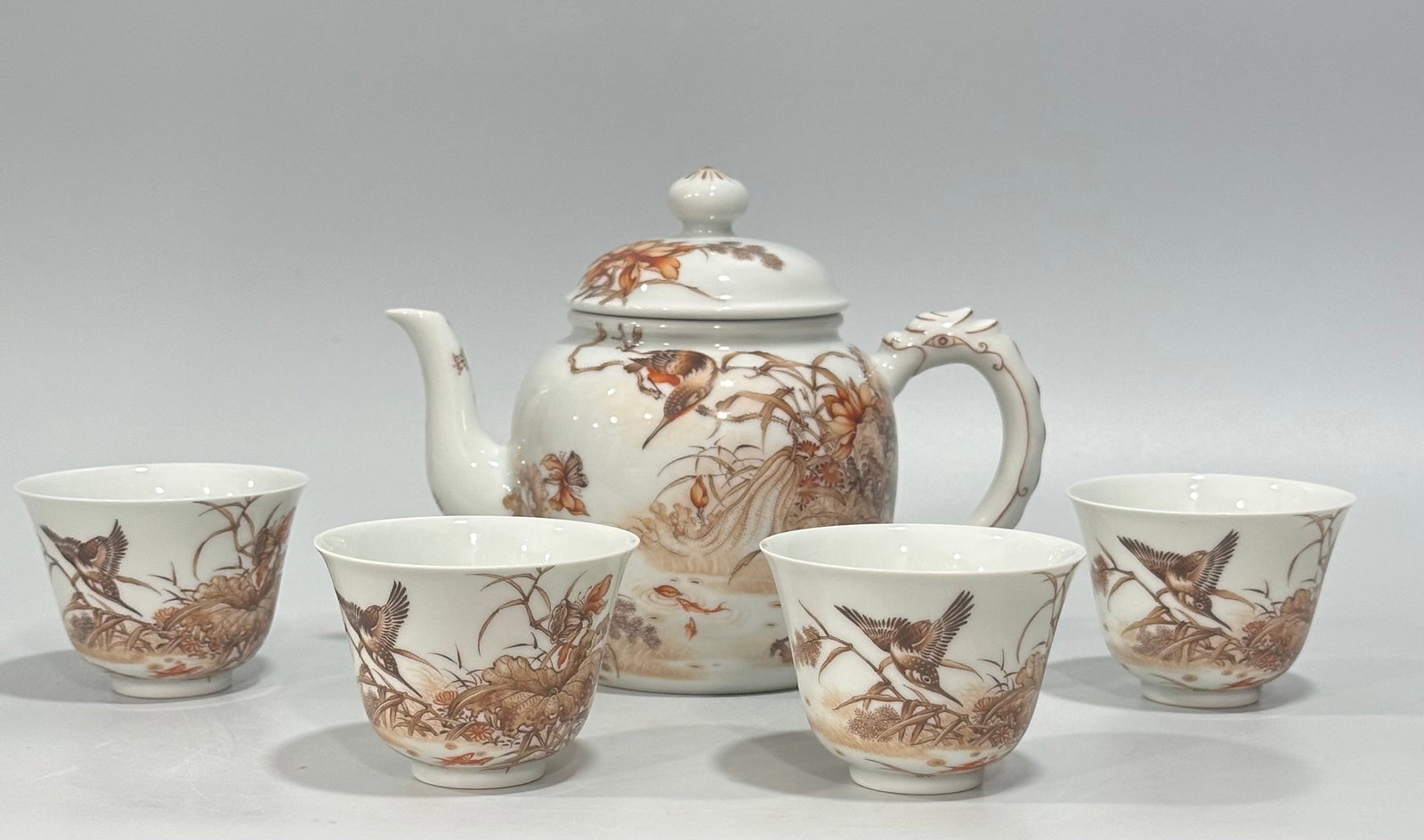 A Set of Fine Ink Color Flower and Bird Pattern Tea Set,with Four Cups: A Set of Fine Ink Color Flower and Bird Pattern Tea Set,with Four Cups,Qing Dynasty,China,Yongzheng Four-character Mark,Size:(Pot)5.1inx3.9in,(Cup)2inx2.8in