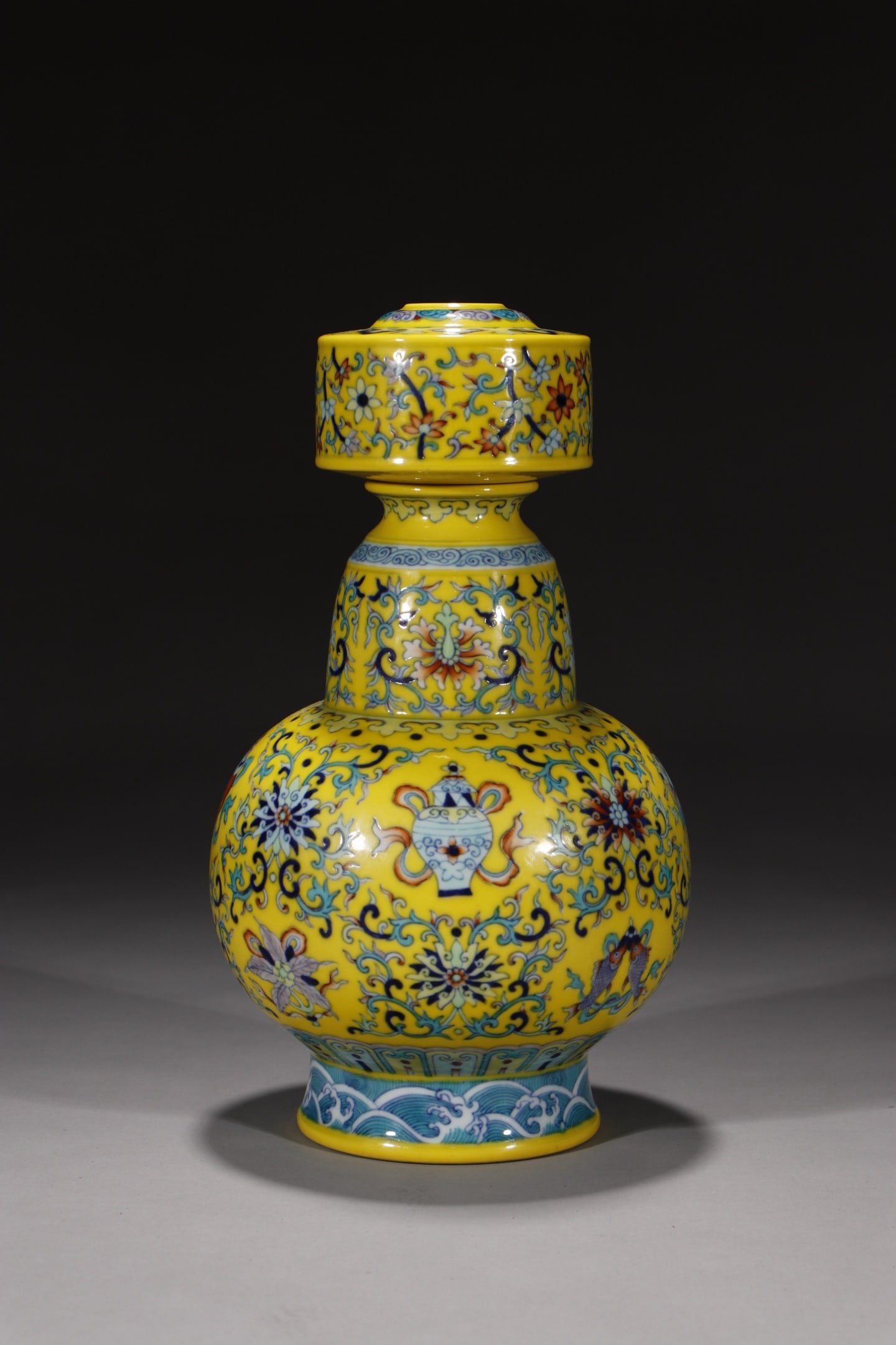 An Exquisite Yellow Ground Doucai Lotus and Eight Treasures Pattern Vase: An Exquisite Yellow Ground Doucai Lotus and Eight Treasures Pattern Vase,Qing Dynasty,China,Qianlong Six-character Mark,Size:10.4in