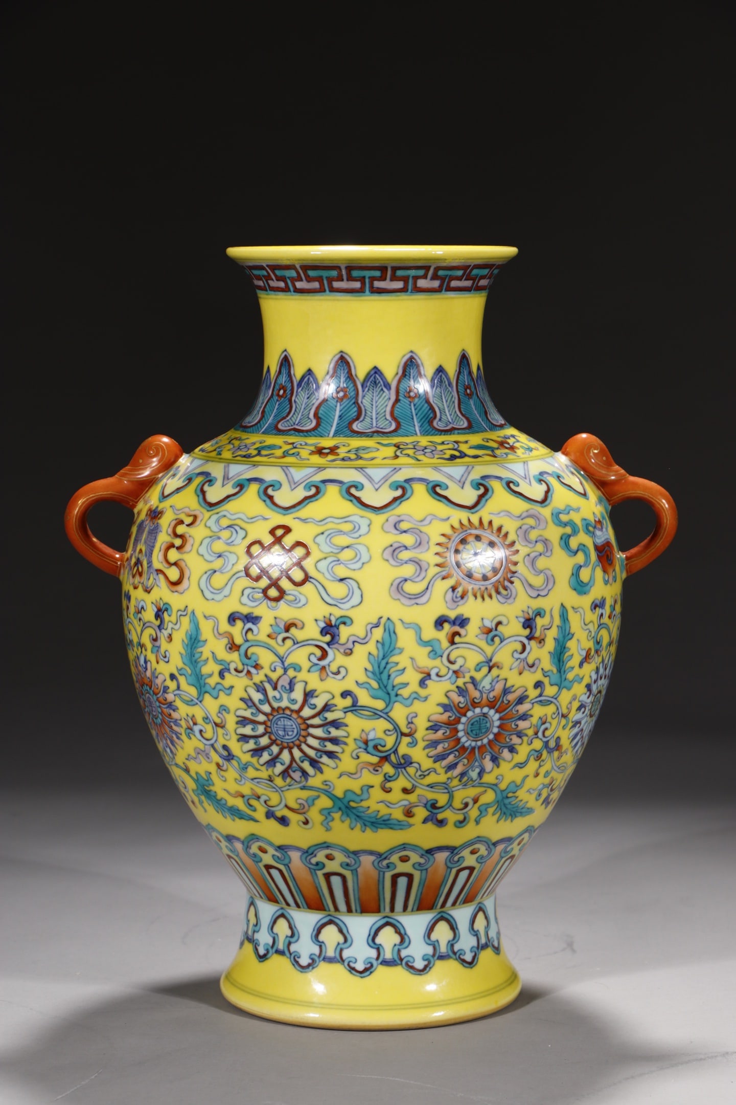An Exquisite Yellow Ground Doucai Lotus and Eight Treasures Pattern Double-Ears Vase: An Exquisite Yellow Ground Doucai Lotus and Eight Treasures Pattern Double-Ears Vase,Qing Dynasty,China,Qianlong Six-character Mark,Size:11.4in 黄地斗彩缠枝莲
