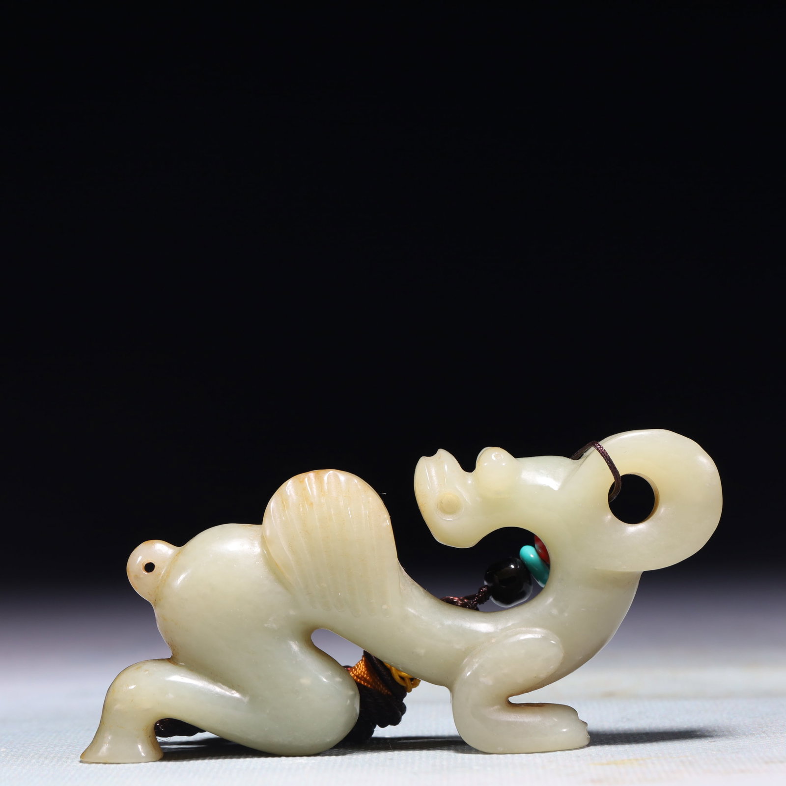 An Exquisite White Jade Pig and Dragon Pendant: An Exquisite White Jade Pig and Dragon Pendant,Qing Dynasty,China,Size:3.9inx0.6inx1.8in,Weight:121.3g 白玉猪龙挂件,中国清代