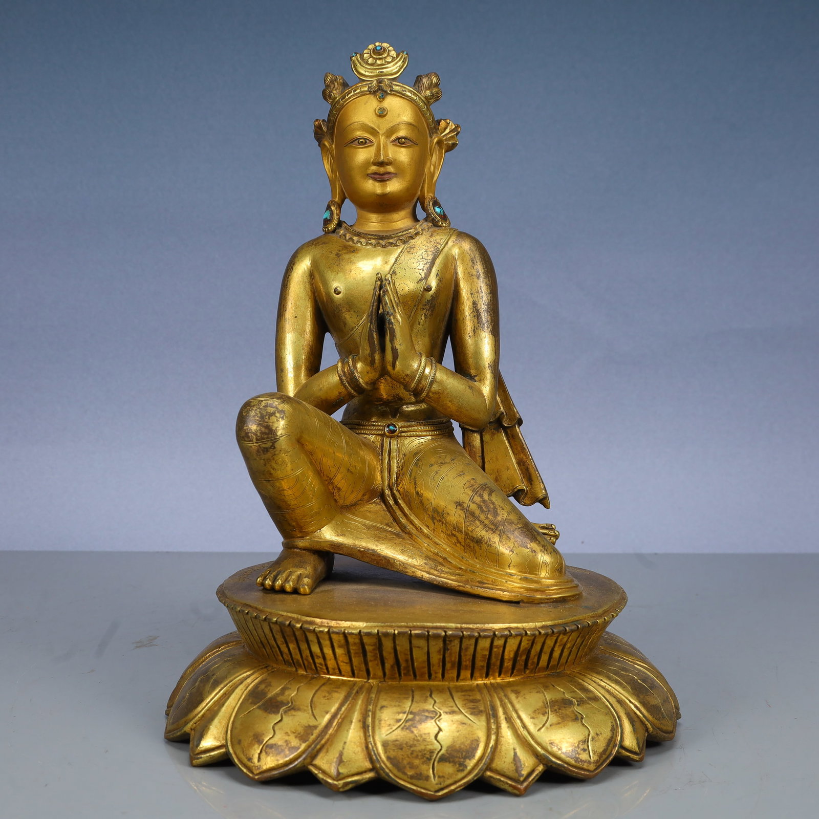 A Solemn Gilt Bronze Statue of Sakyamuni,Inlaid Turquoise,With Inscription: A Solemn Gilt Bronze Statue of Sakyamuni,Inlaid Turquoise,With Inscription,Qing Dynasty, China,Size:8.7inx12.2in,Weight:6250g