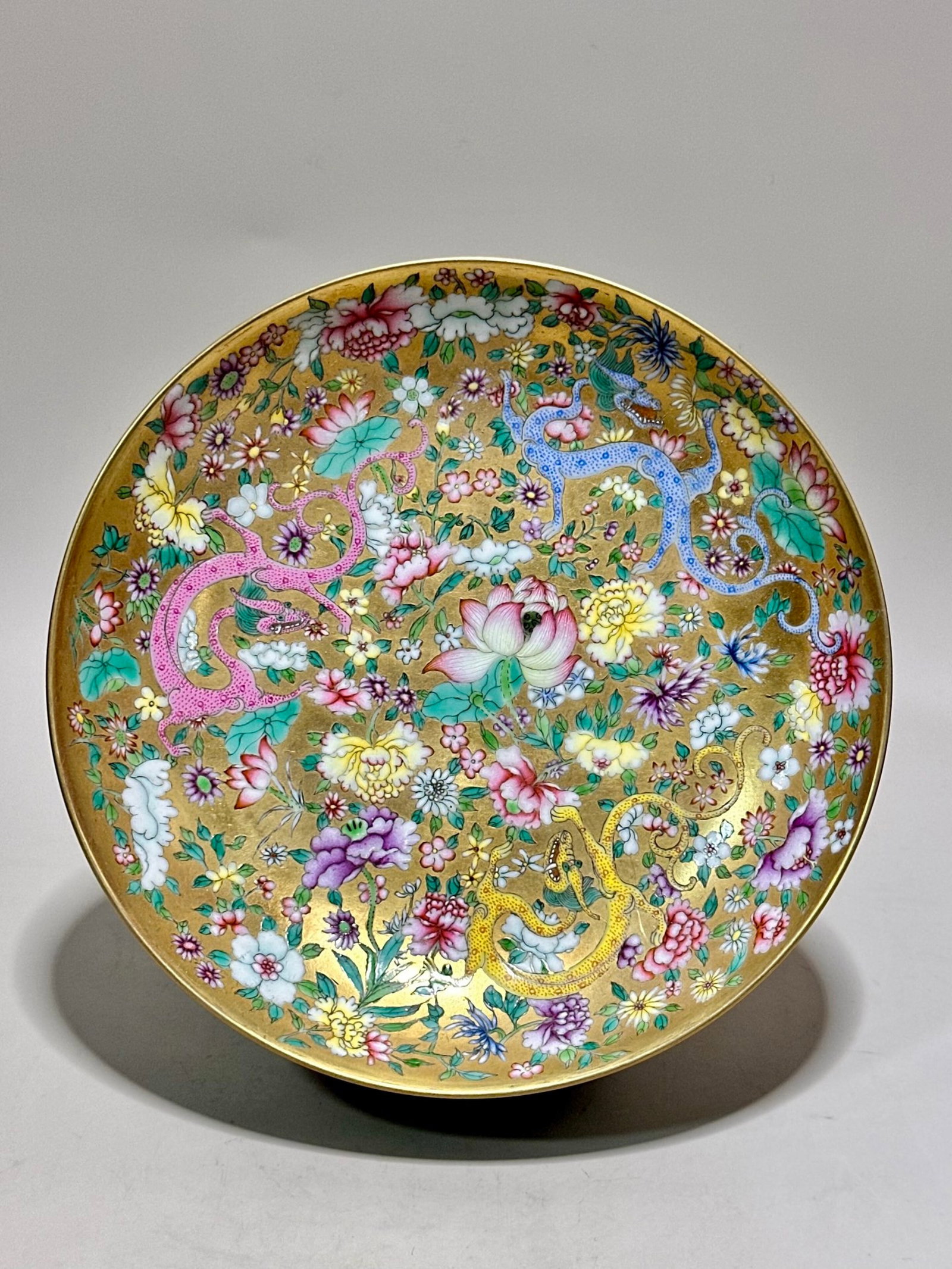 An Exquisite Gold Ground Famille-Rose Flower and Dragon Pattern Plate: An Exquisite Gold Ground Famille-Rose Flower and Dragon Pattern Plate,Qing Dynasty,China,Tongzhi Six-character Mark,Size:1.4inx6.5in