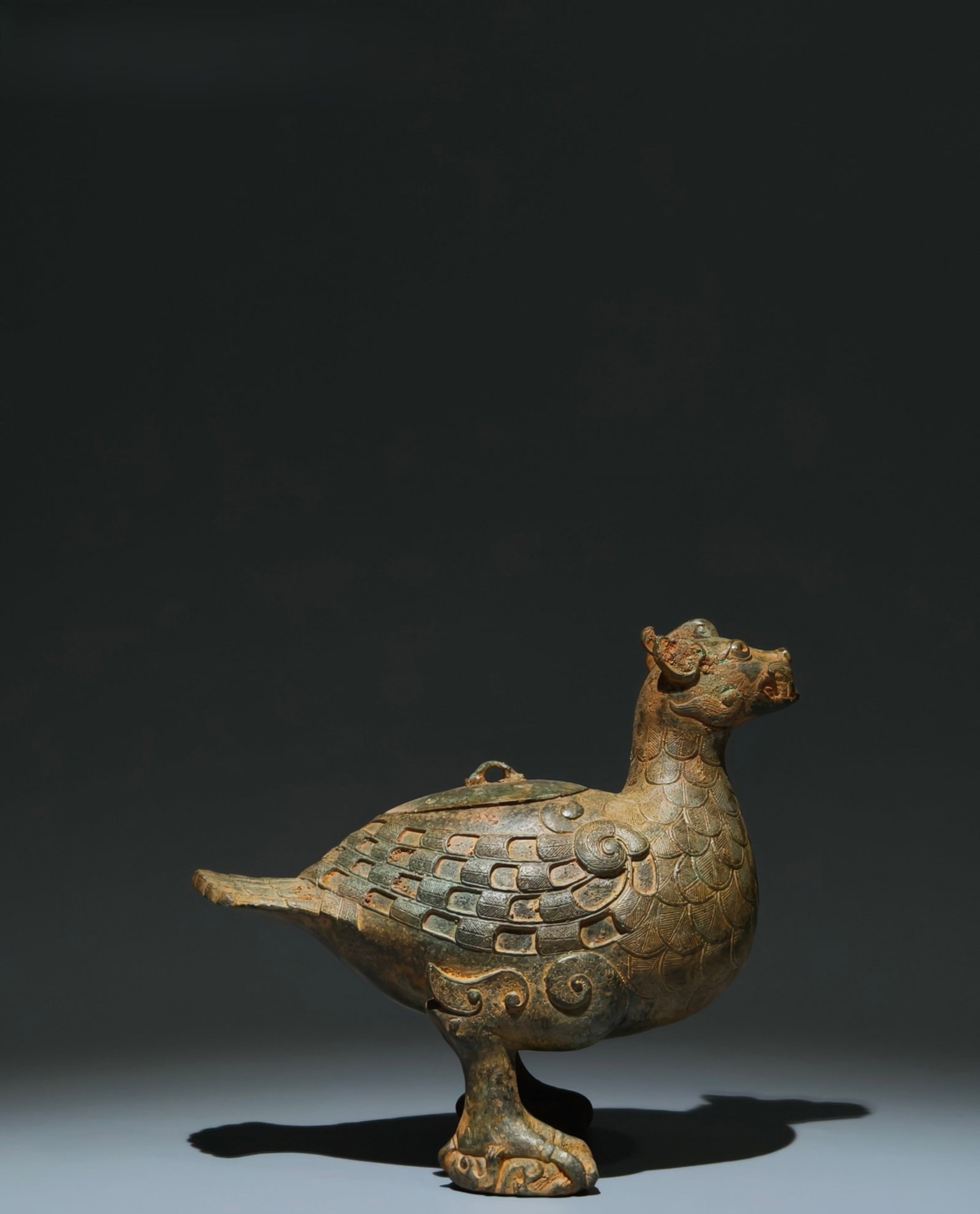 An Archaic Bronze Beast Ornament: An Archaic Bronze Beast Ornament,the Warring States period in China,Size:7.1inx8.3inx5.1in 青铜兽摆件,中国战国时期