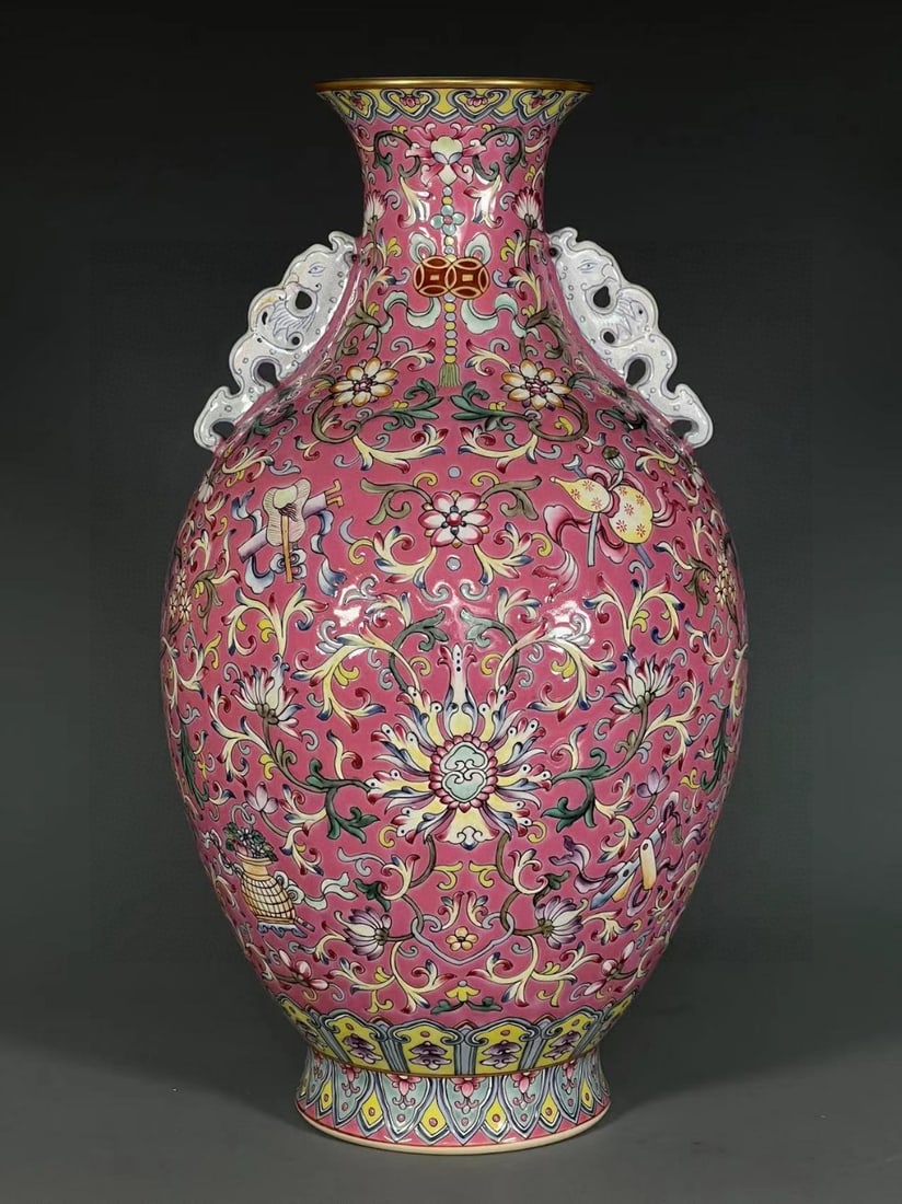 A Rare Ruby Red-Ground Enamel Painted Gold Lotus and Eight Treasures Pattern Double-Ears Vase: A Rare Ruby Red-Ground Enamel Painted Gold Lotus and Eight Treasures Pattern Double-Ears Vase,Qing Dynasty,China,Qianlong Six-character Mark,Size:13.5inx3.5inx4.2in 胭脂红地