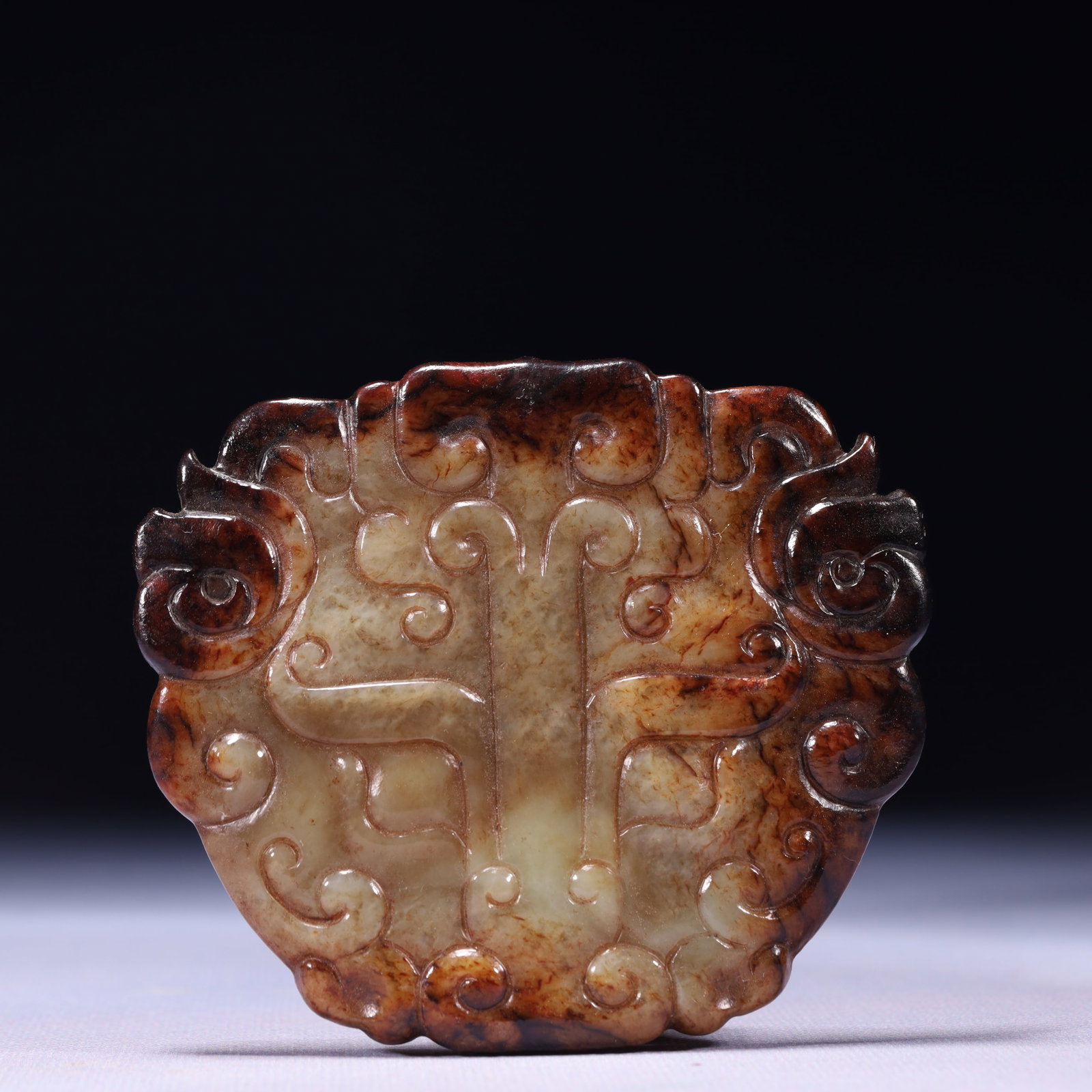 An Exquisite Archaic Jade Beast-Face Pattern Ornament: An Exquisite Archaic Jade Beast-Face Pattern Ornament,Ancient Time,China,Size:3.7inx3.3inx0.4in,Weight:114g 高古玉兽面纹摆件,中国远