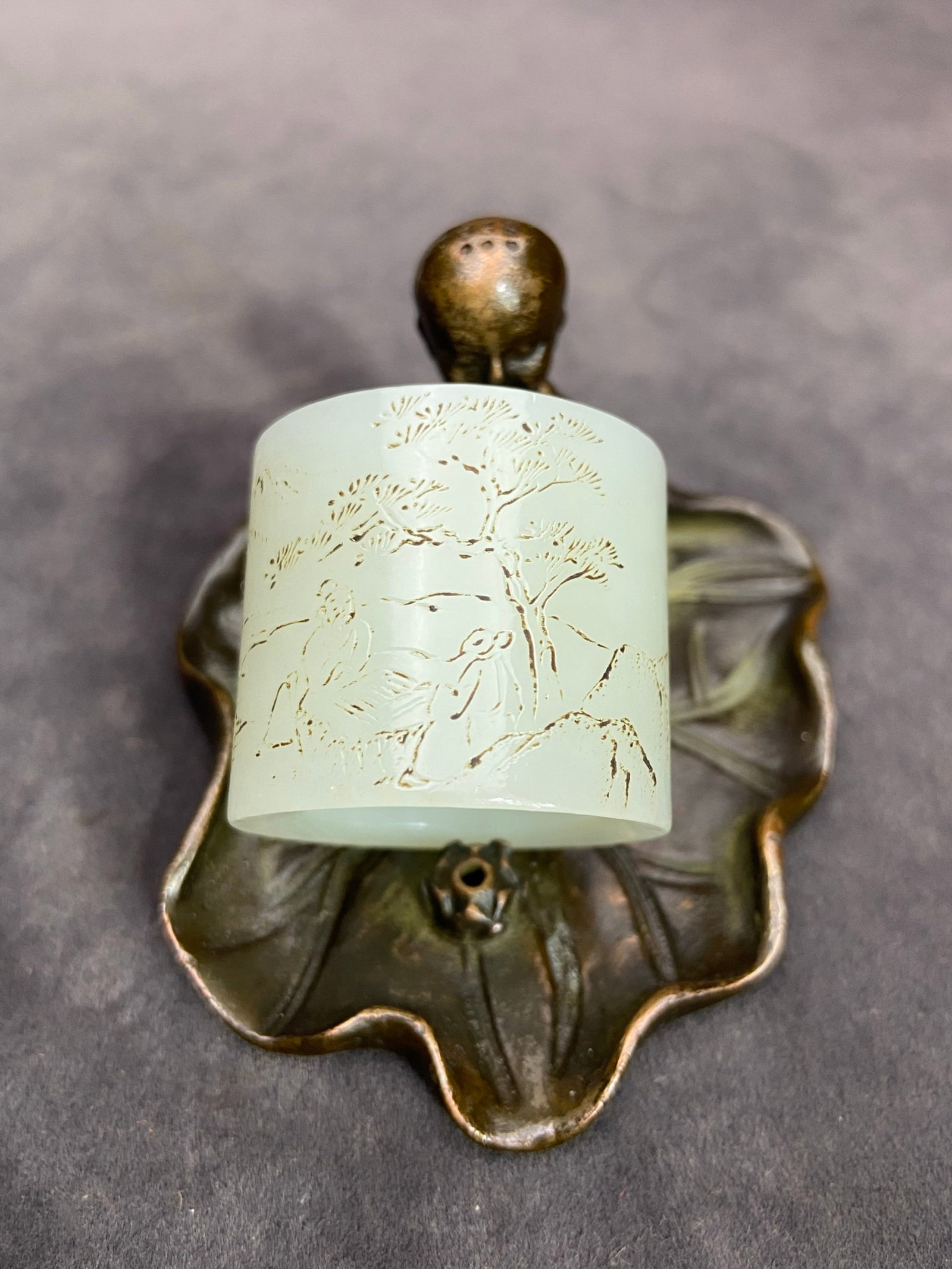 An Exquisite White Jade Landscape and Figure Pattern Fingerstall,with poem: An Exquisite White Jade Landscape and Figure Pattern Fingerstall,with poem,Qing Dynasty,China,Size:1.2inx0.9in,Weight:38g 白玉山水人物纹扳指,ñ