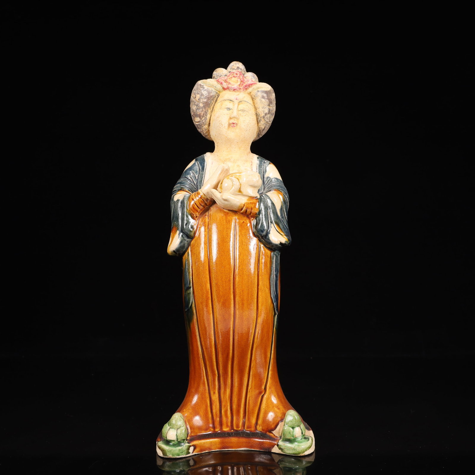 A Rare Tang Tri-Color Glazed Pottery Woman Ornament: A Rare Tang Tri-Color Glazed Pottery Woman Ornament,Tang Dynasty, China,Chinese Tang Tri-colored Pottery, or Tang Sancai, flourished during the Tang Dynasty (618–907 AD). It's renowned for its v