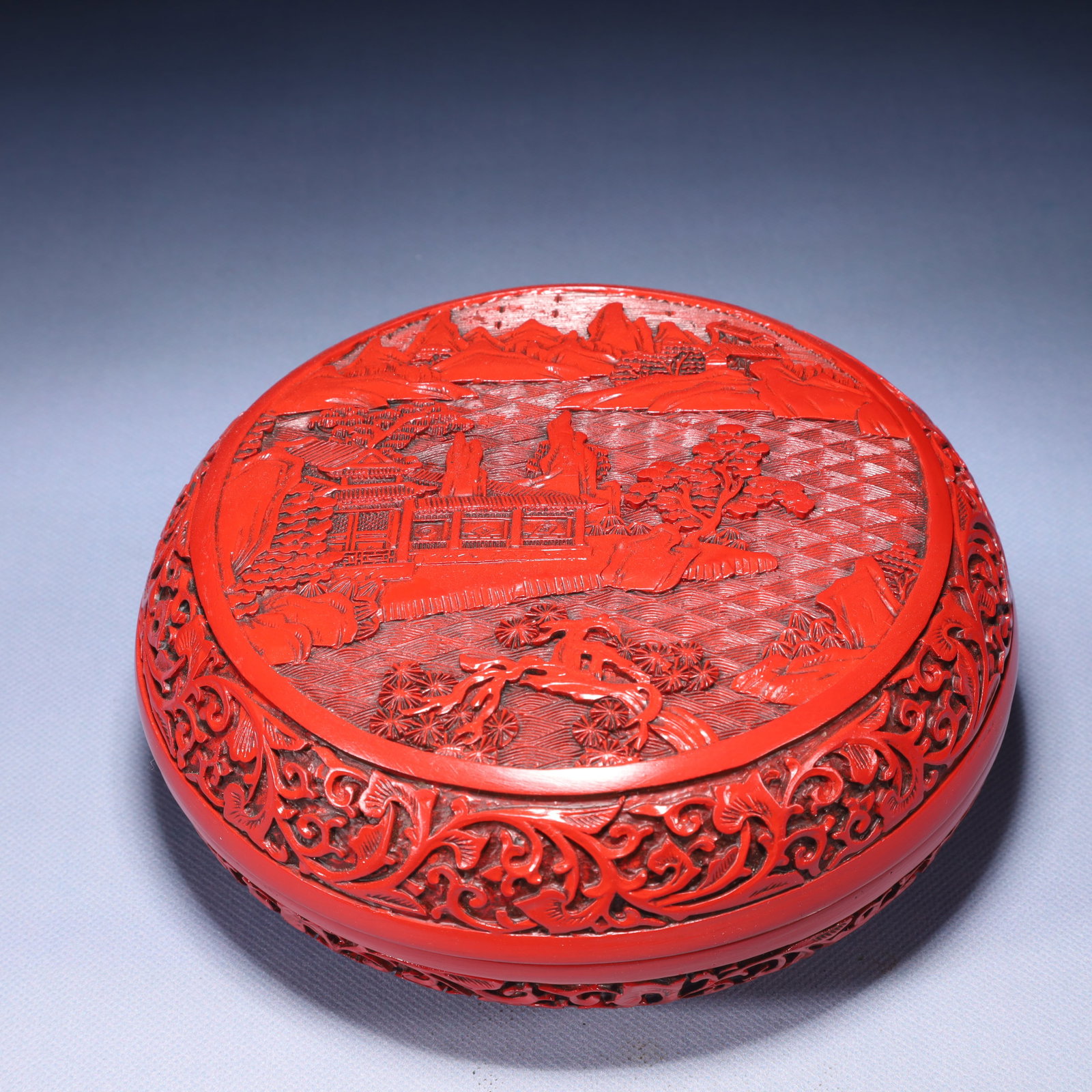 An Exquisite Carved Red Lacquer Landscape and Figure Pattern Box with Cover: An Exquisite Carved Red Lacquer Landscape and Figure Pattern Box with Cover,Qing Dynasty,China,Qianlong Four-character Mark,Size:7.1inx3.1in,Weight:750g 剔红漆山水人