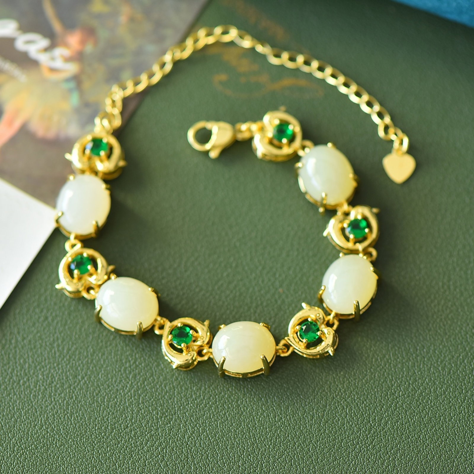 An Exquisite Bronze-Gold Plated Inlaid White Jade Bracelet: An Exquisite Bronze-Gold Plated Inlaid White Jade Bracelet,Size:0.4inx0.5in 铜镀金镶白玉手链