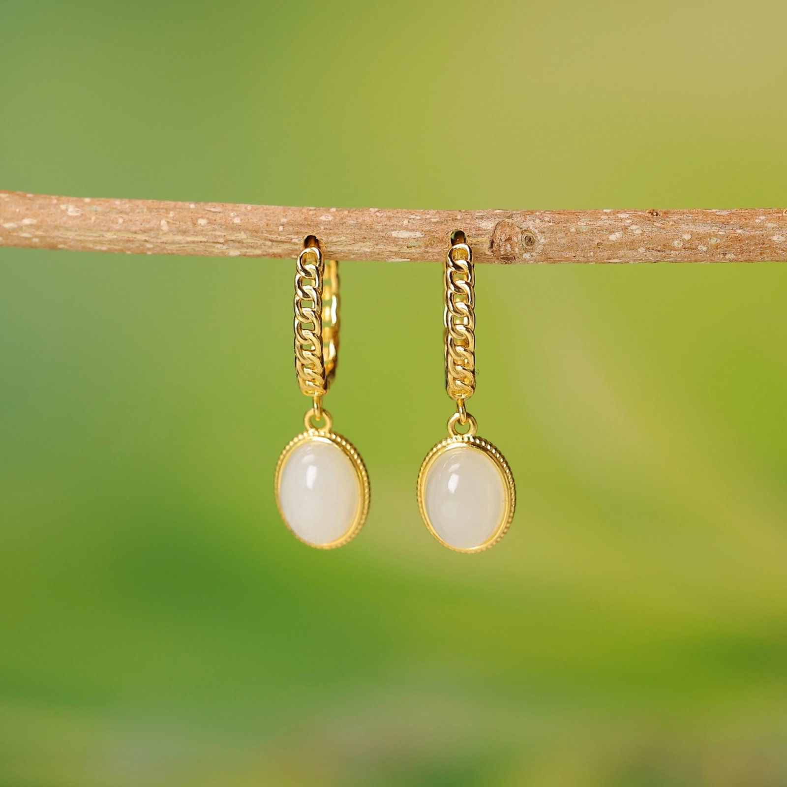 A Pair of Exquisite Sterling Silver-Gold Plated Inlaid White Jade Earrings: A Pair of Exquisite Sterling Silver-Gold Plated Inlaid White Jade Earrings,Size:0.2inx0.3in 一对纯银镀金镶白玉耳环