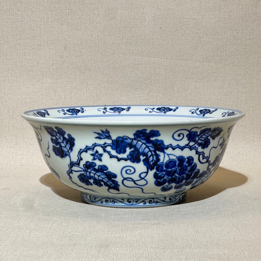 An Exquisite Blue and White Grapes Pattern Bowl: An Exquisite Blue and White Grapes Pattern Bowl,Ming Dynasty,China,Xuande Six-character Mark,Size:4.4inx10.8in 青花葡萄纹碗,中国明代,宣