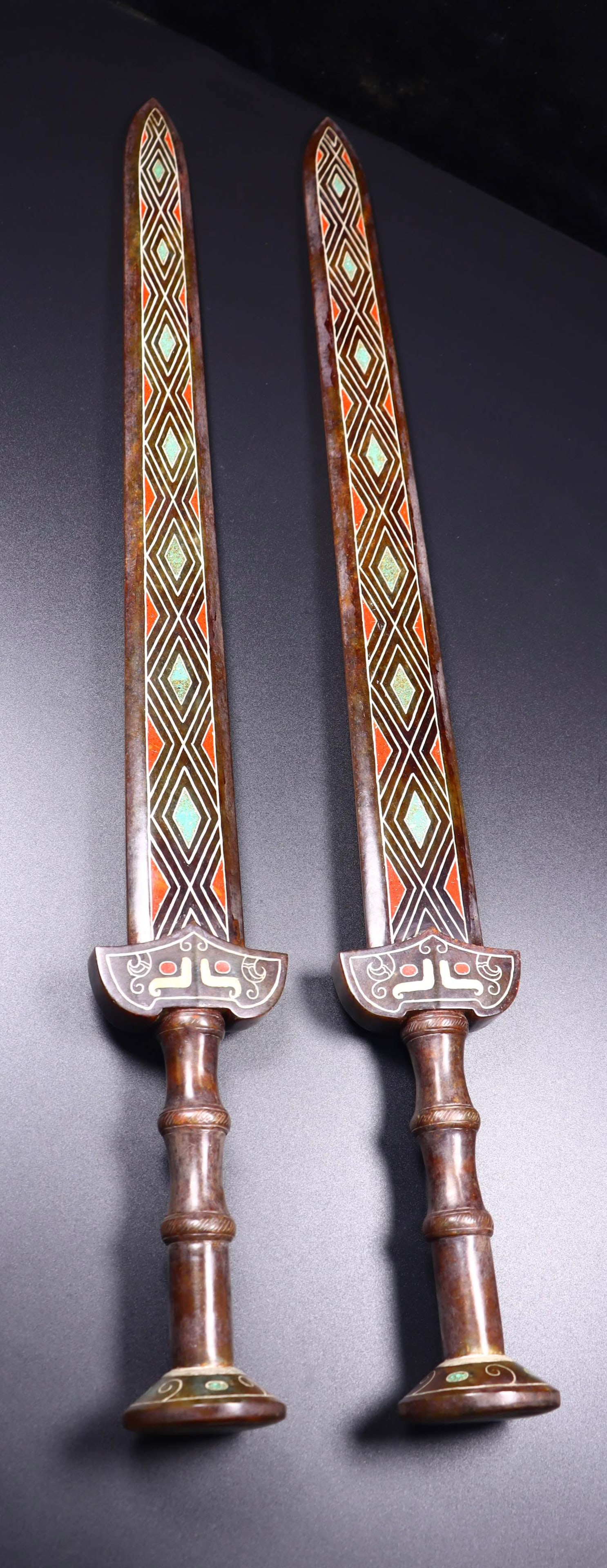 A Pair of Huge Gaogu Jade Swords,Inlaid Turquoise: A Pair of Huge Gaogu Jade Swords,Inlaid Turquoise,Qing Dynasty, China,Size:25.2inx2.8inx2.2in,Weight:734g*2 一对高古玉剑,嵌松石,中国&#