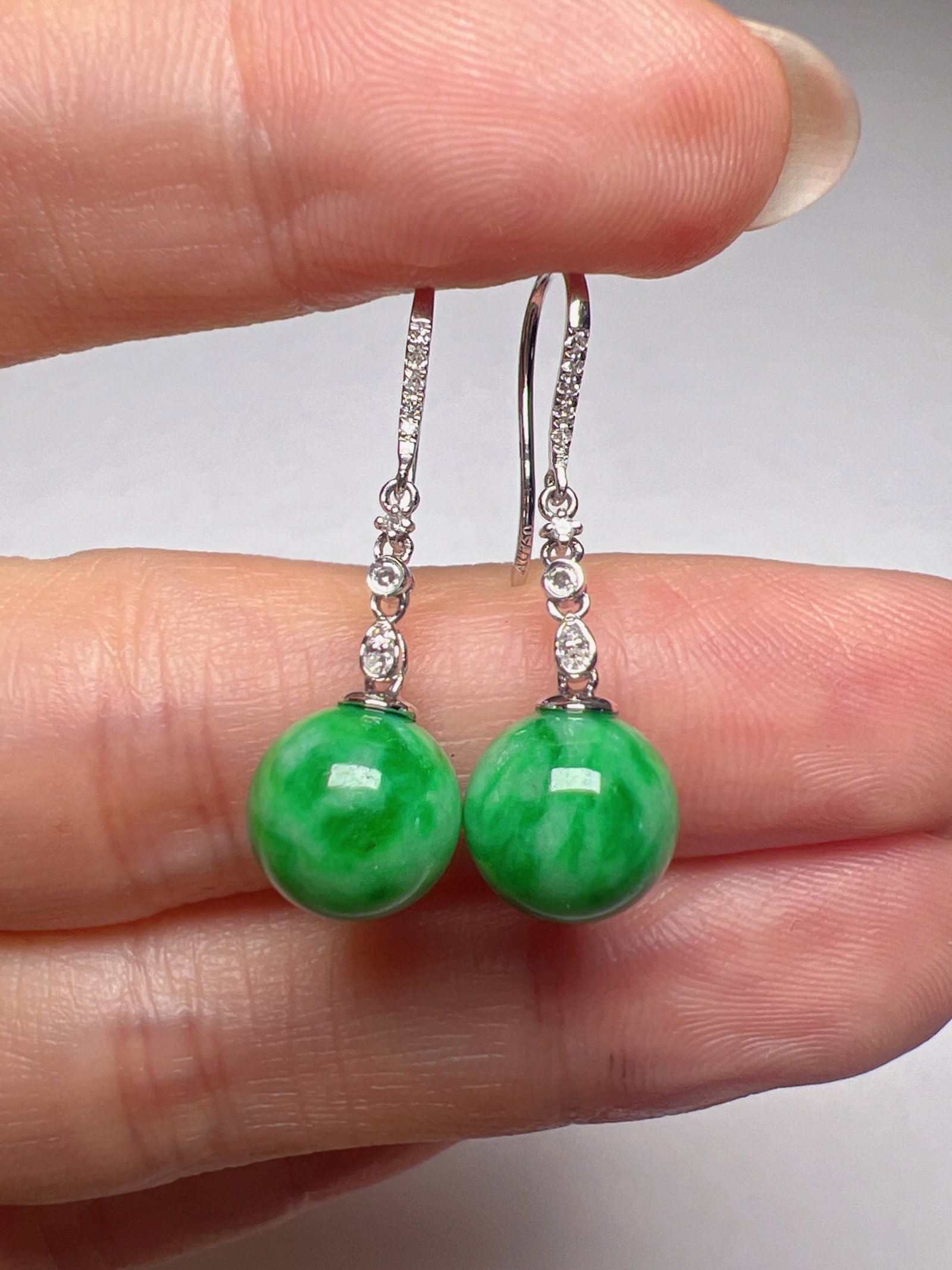 A Pair of Exquisite 18k Gold Diamond Inlaid Jadeite Earrings: A Pair of Exquisite 18k Gold Diamond Inlaid Jadeite Earrings,Size(Loose Stone):0.3in 一对18k金钻镶嵌翡翠耳环