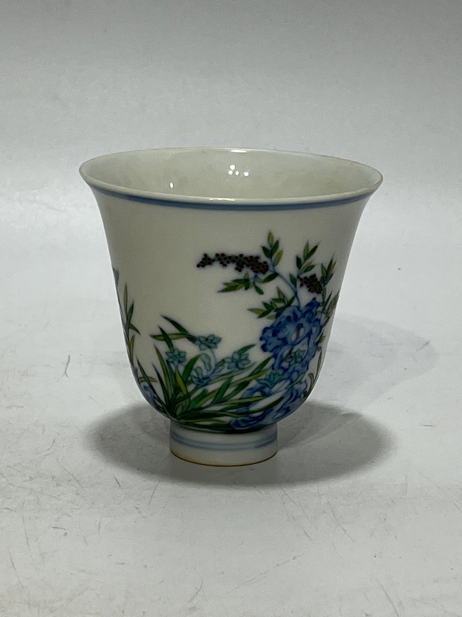 An Exquisite Blue and White Doucai Flower Pattern Cup: An Exquisite Blue and White Doucai Flower Pattern Cup,Qing Dynasty,China,Yongzheng Six-character Mark,Size:3.2in