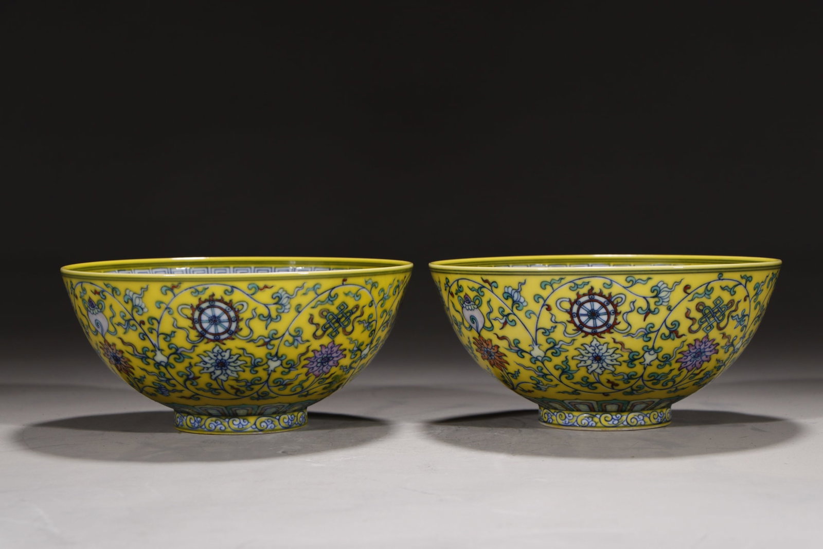 A Pair of Exquisite Yellow Ground Doucai Lotus and Eight Treasures Pattern Bowls: A Pair of Exquisite Yellow Ground Doucai Lotus and Eight Treasures Pattern Bowls,Qing Dynasty,China,Yongzheng Six-character Mark,Size:3.1inx6.7in 一对黄地斗彩ಶ