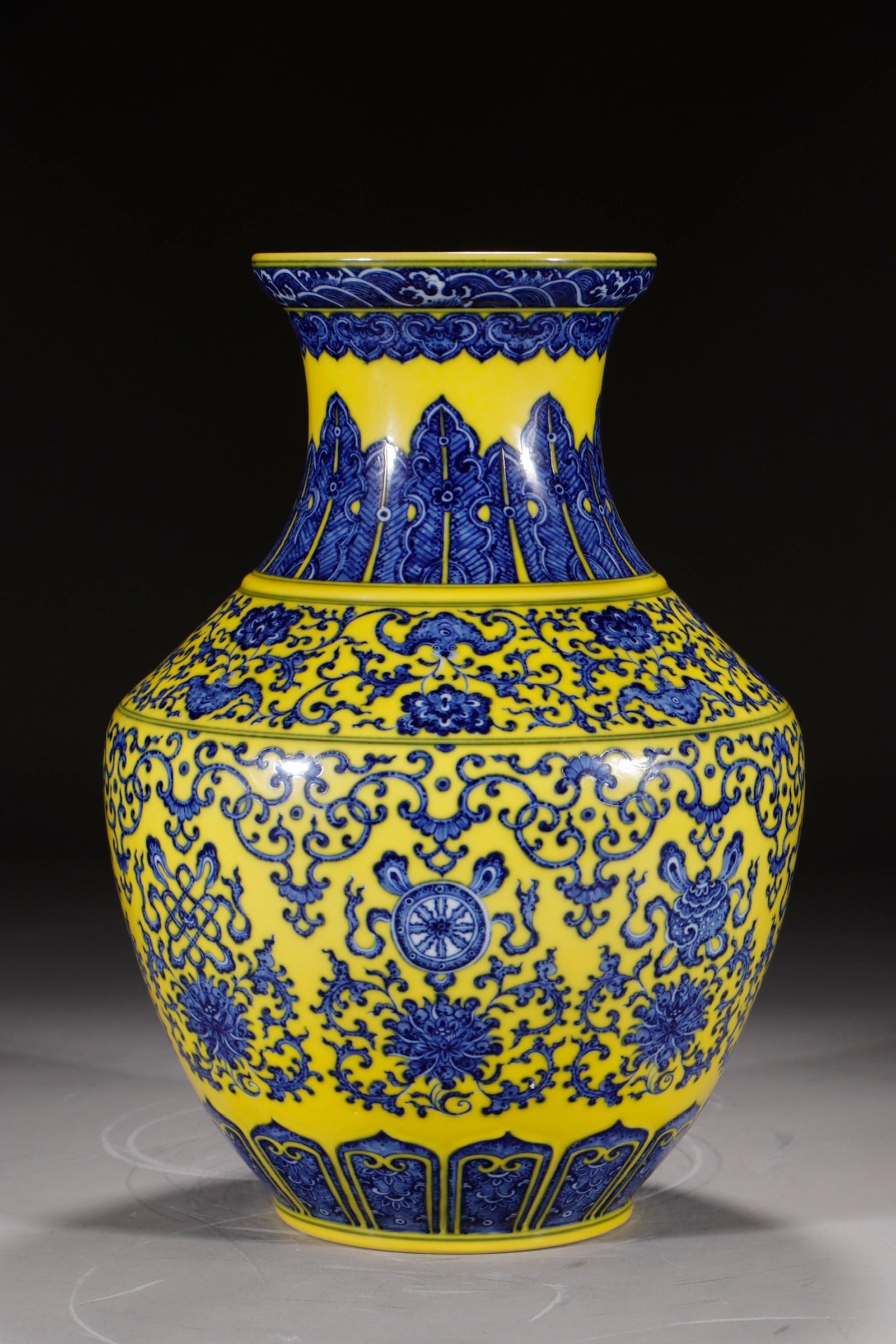 A Rare Yellow Ground Blue and White Lotus and Eight Treasures Pattern Vase: A Rare Yellow Ground Blue and White Lotus and Eight Treasures Pattern Vase,Qing Dynasty,China,Qianlong Six-character Mark,Size:14.1in 黄地青花缠枝莲八&#