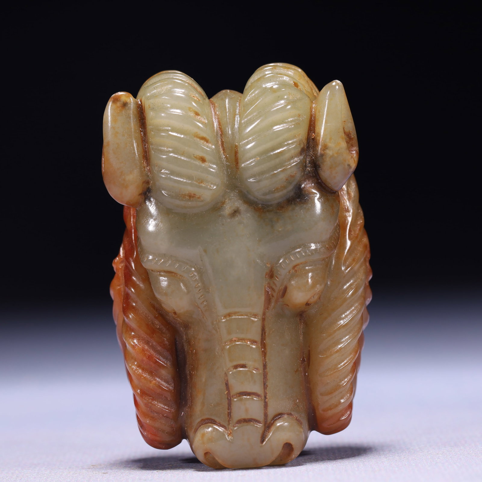 An Exquisite Green Jade Sheep Head Ornament: An Exquisite Green Jade Sheep Head Ornament,Qing Dynasty,China,Size:2.8inx1.6inx0.8in,Weight:134g 青玉羊头摆件,中国清代