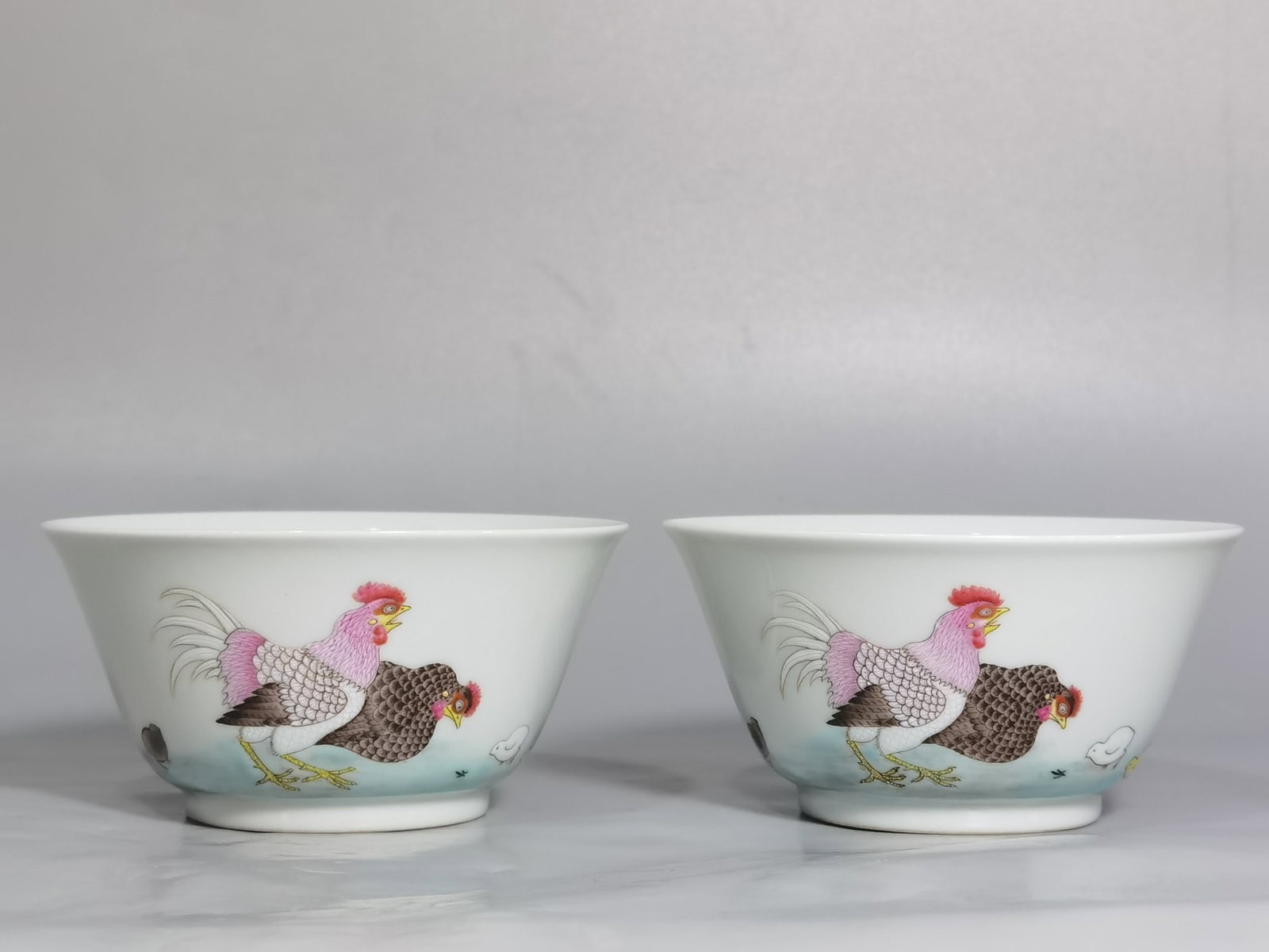 A Pair of Exquisite Famille-Rose Rooster Pattern Cups: A Pair of Exquisite Famille-Rose Rooster Pattern Cups,Qing Dynasty,China,Yongzheng Six-character Mark,Size:3.8inx1.9in