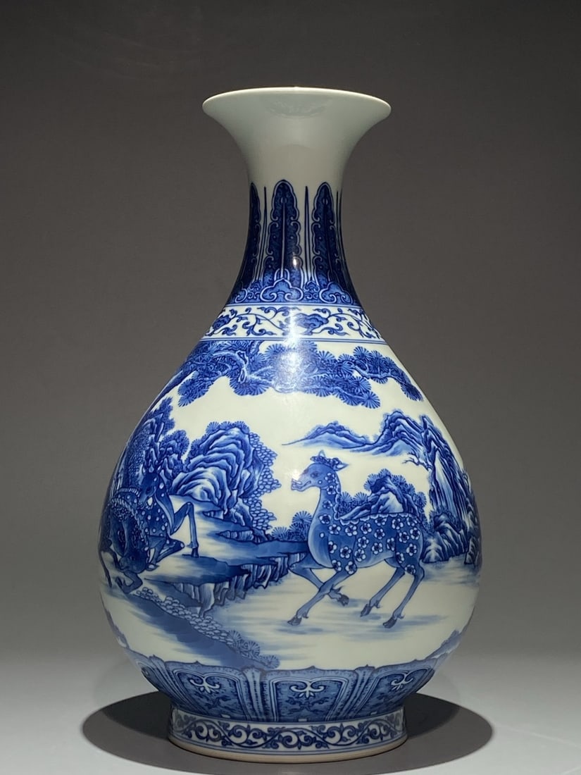 A Rare Blue and White Pine and Deer Pattern Vase: A Rare Blue and White Pine and Deer Pattern Vase,Qing Dynasty,China,Qianlong Six-character Mark,Size:13.4inx8.3in 青花松鹿纹瓶,中国清代,