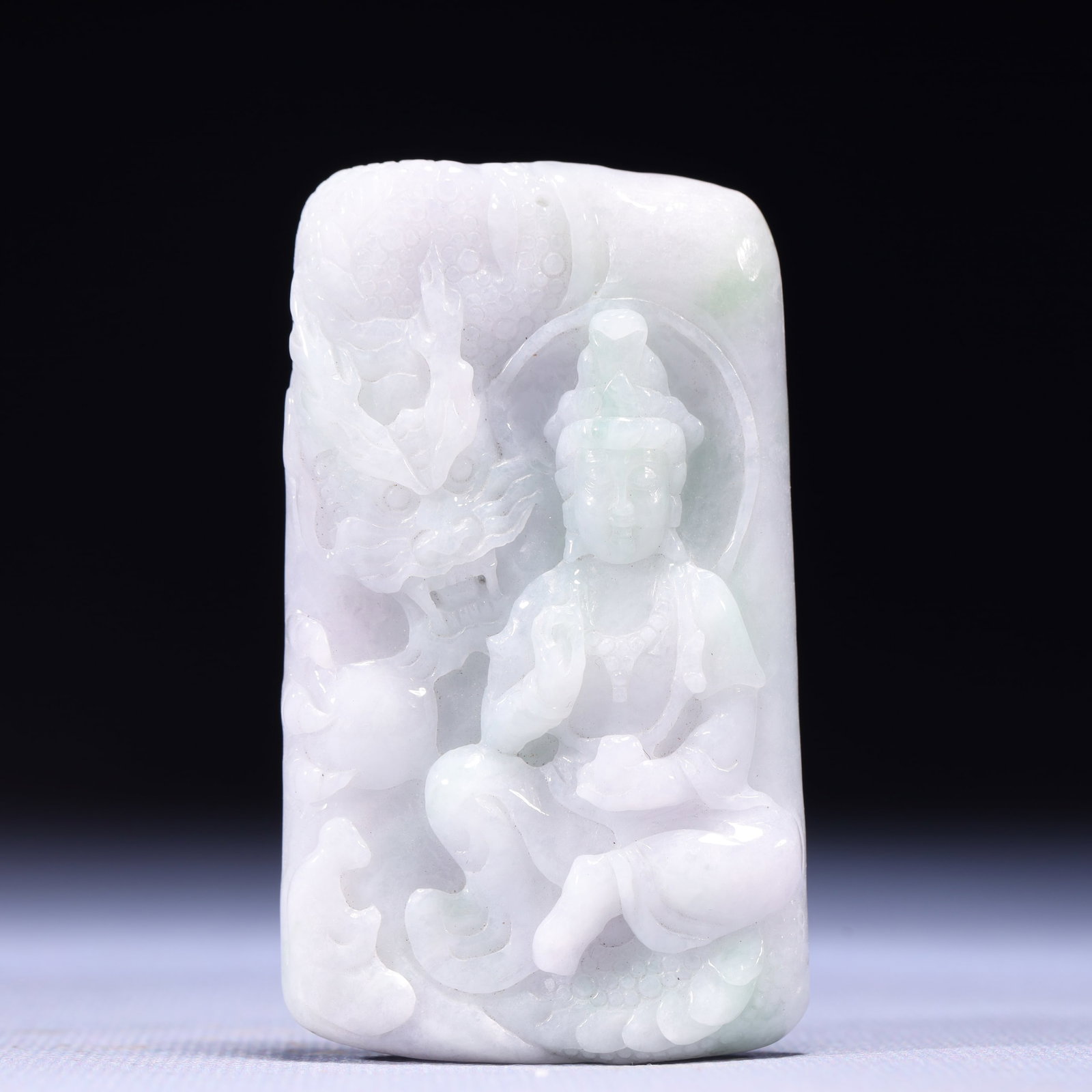 An Exquisite Jadeite Statue of Avalokitesvara Pendant: An Exquisite Jadeite Statue of Avalokitesvara Pendant,Qing Dynasty,China,Size:1.6inx0.3inx2.8in,Weight:75g 翡翠观音像挂件,中国清代