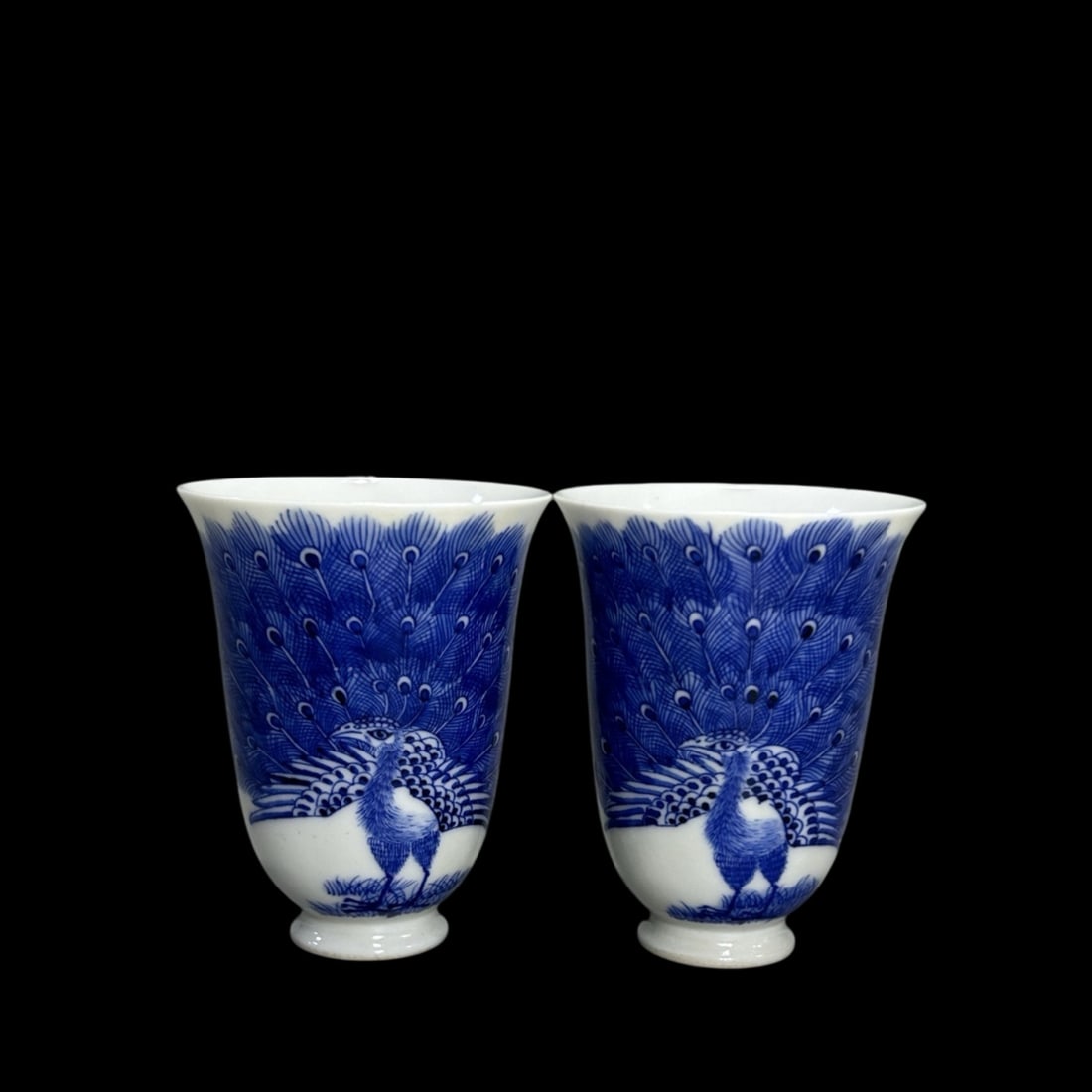 A Pair of Exquisite Blue and White Peacock Pattern Cups: A Pair of Exquisite Blue and White Peacock Pattern Cups,Qing Dynasty,China,Kangxi Six-character Mark,Size:2.2inx3in