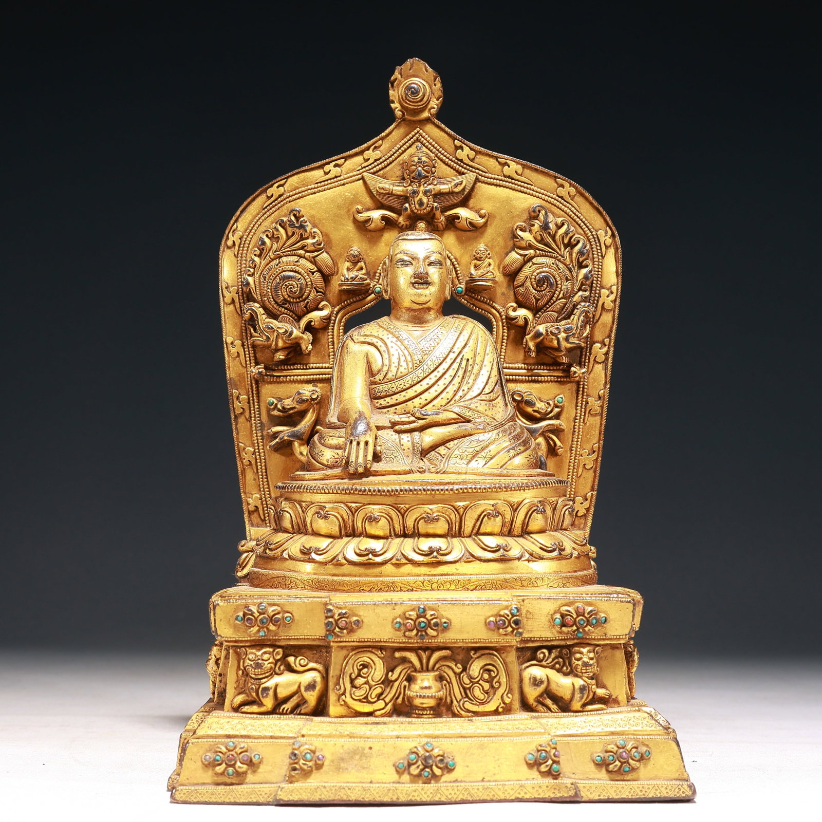 A Solemn Gilt Bronze Buddha Statue,Inlaid Turquoise: A Solemn Gilt Bronze Buddha Statue,Inlaid Turquoise,Qing Dynasty,China,Size:6.7inx4.7inx11in,Weight:3250g 铜鎏金佛像,嵌绿松石,中国