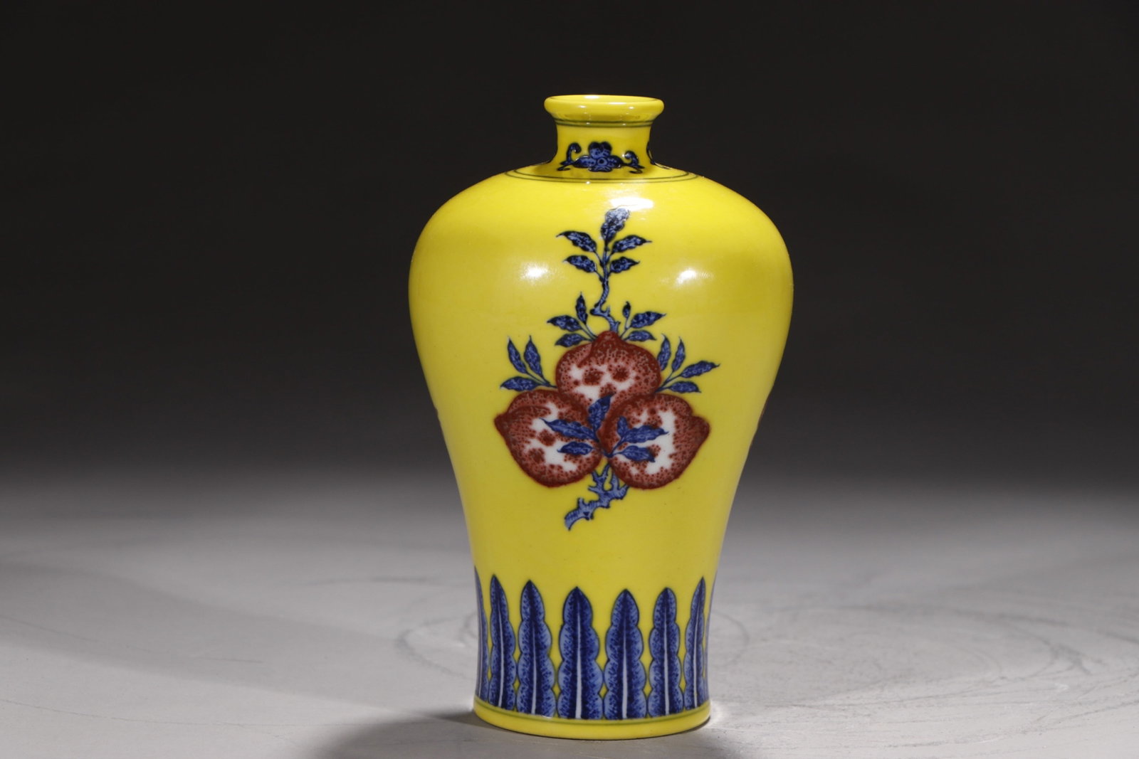 An Exquisite Yellow Ground Underglaze-Red Flower and Fruit Pattern Vase: An Exquisite Yellow Ground Underglaze-Red Flower and Fruit Pattern Vase,Qing Dynasty,China,Qianlong Six-character Mark,Size:6.7in 黄地釉里红花果纹ல