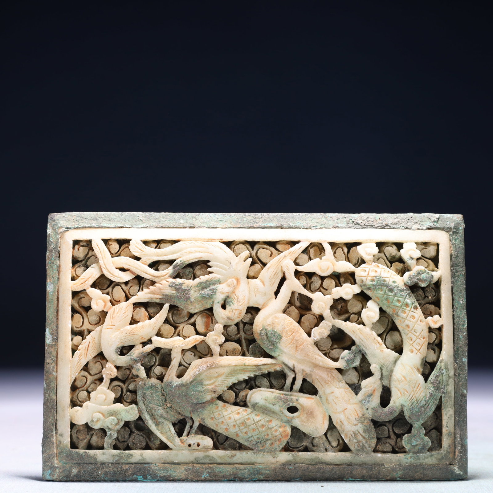 An Archaic Bronze Inlaid White Jade Flower and Phoenix Pattern Ornament: An Archaic Bronze Inlaid White Jade Flower and Phoenix Pattern Ornament,the Warring States period in China,Size:5.9inx3.7in,Weight:531g 青铜嵌白玉花卉凤