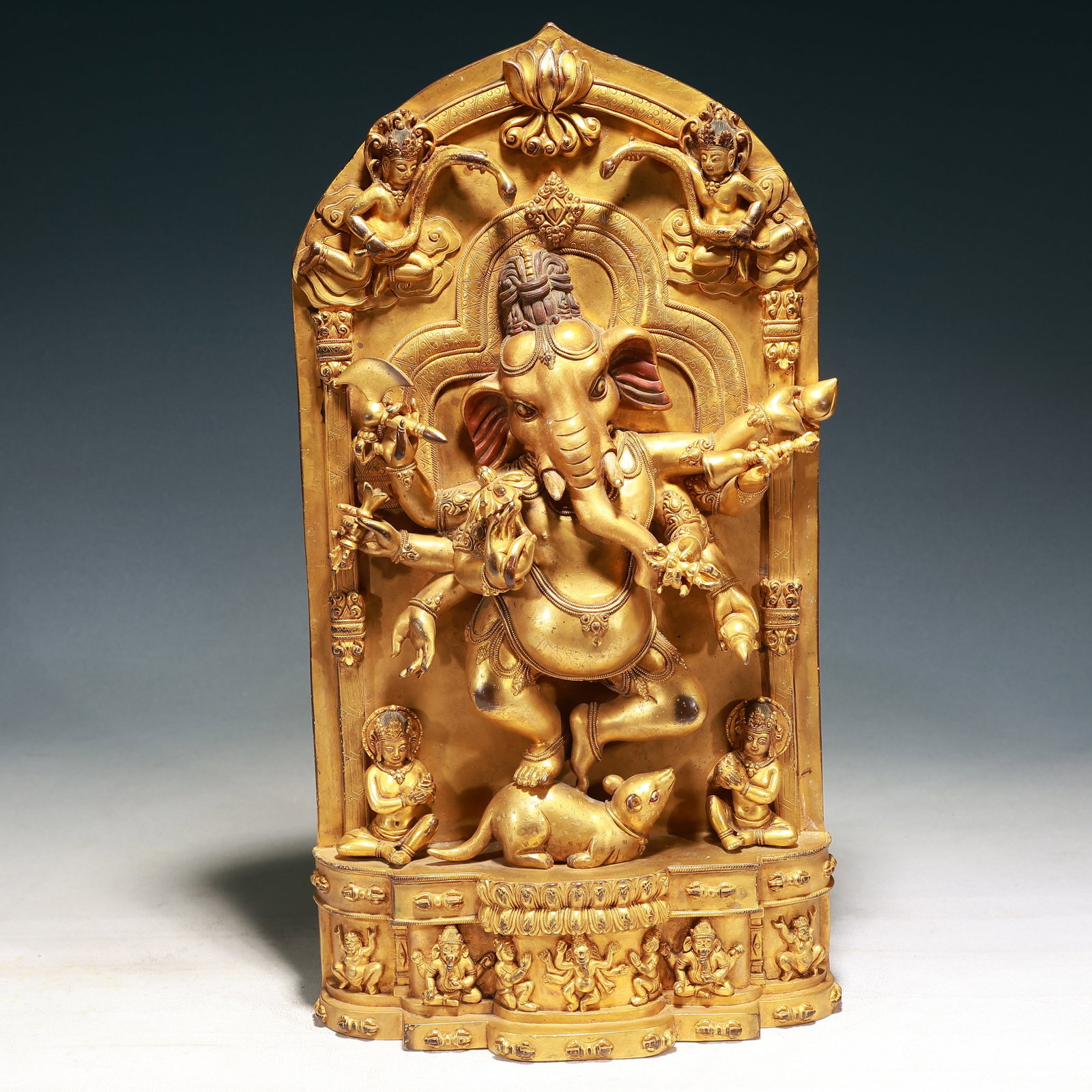 A Solemn Gilt Bronze Statue of Ganesh: A Solemn Gilt Bronze Statue of Ganesh,Qing Dynasty, China,Size:10.6inx3.5inx19.3in,Weight:9350g 铜鎏金象鼻财神像,中国清代