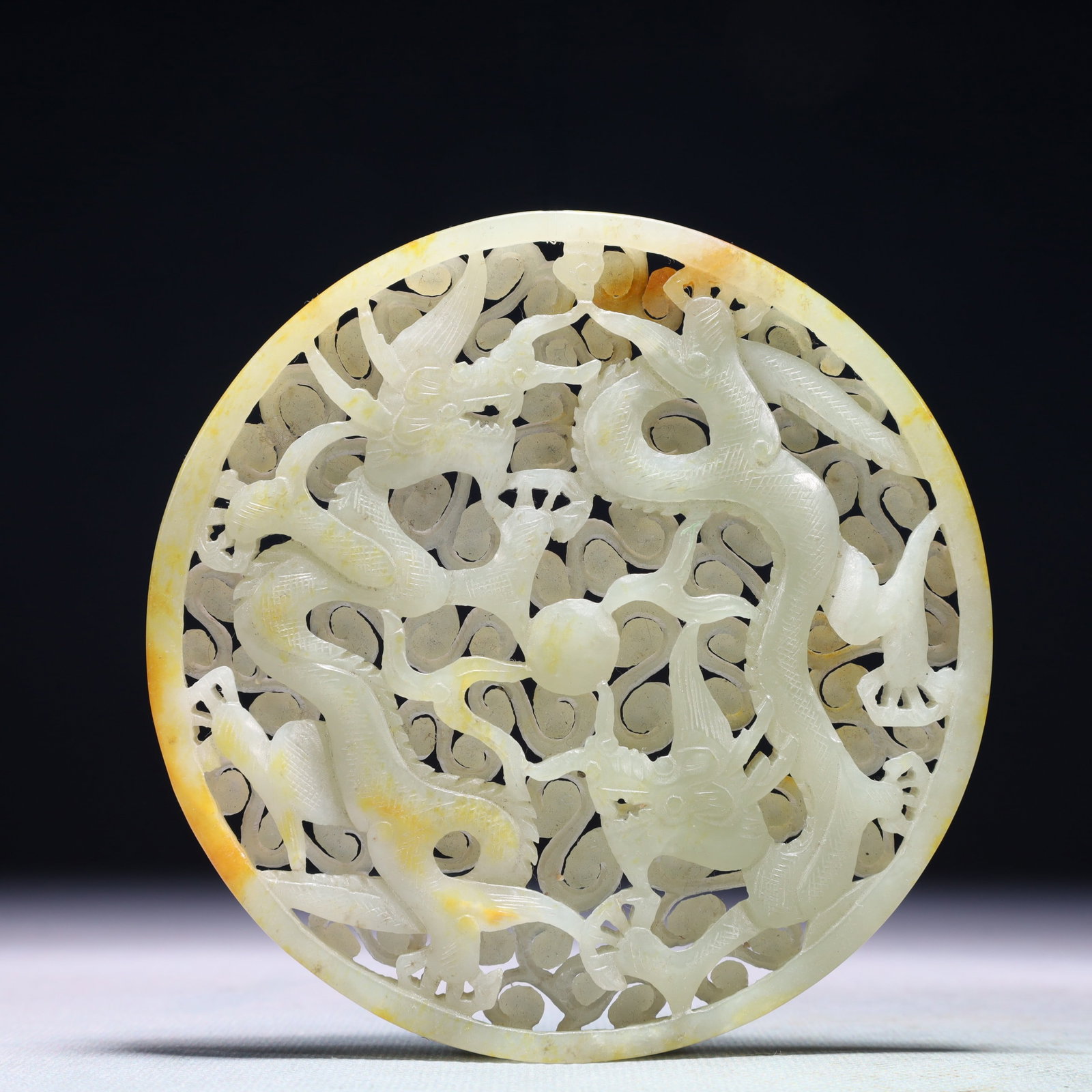 An Exquisite White Jade Auspicious Cloud and Dragon Pattern Pendant: An Exquisite White Jade Auspicious Cloud and Dragon Pattern Pendant,Qing Dynasty,China,Size:4.3inx0.3in,Weight:165.1g 白玉祥云龙纹佩,中国清&