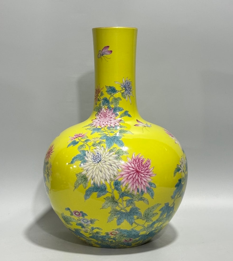 A Rare Yellow Glazed Enamel Flower and Butterfly Pattern Vase: A Rare Yellow Glazed Enamel Flower and Butterfly Pattern Vase,Qing Dynasty,China,Yongzheng Six-character Mark,Size:14.8inx9.8in 黄釉珐琅彩花卉蝴蝶