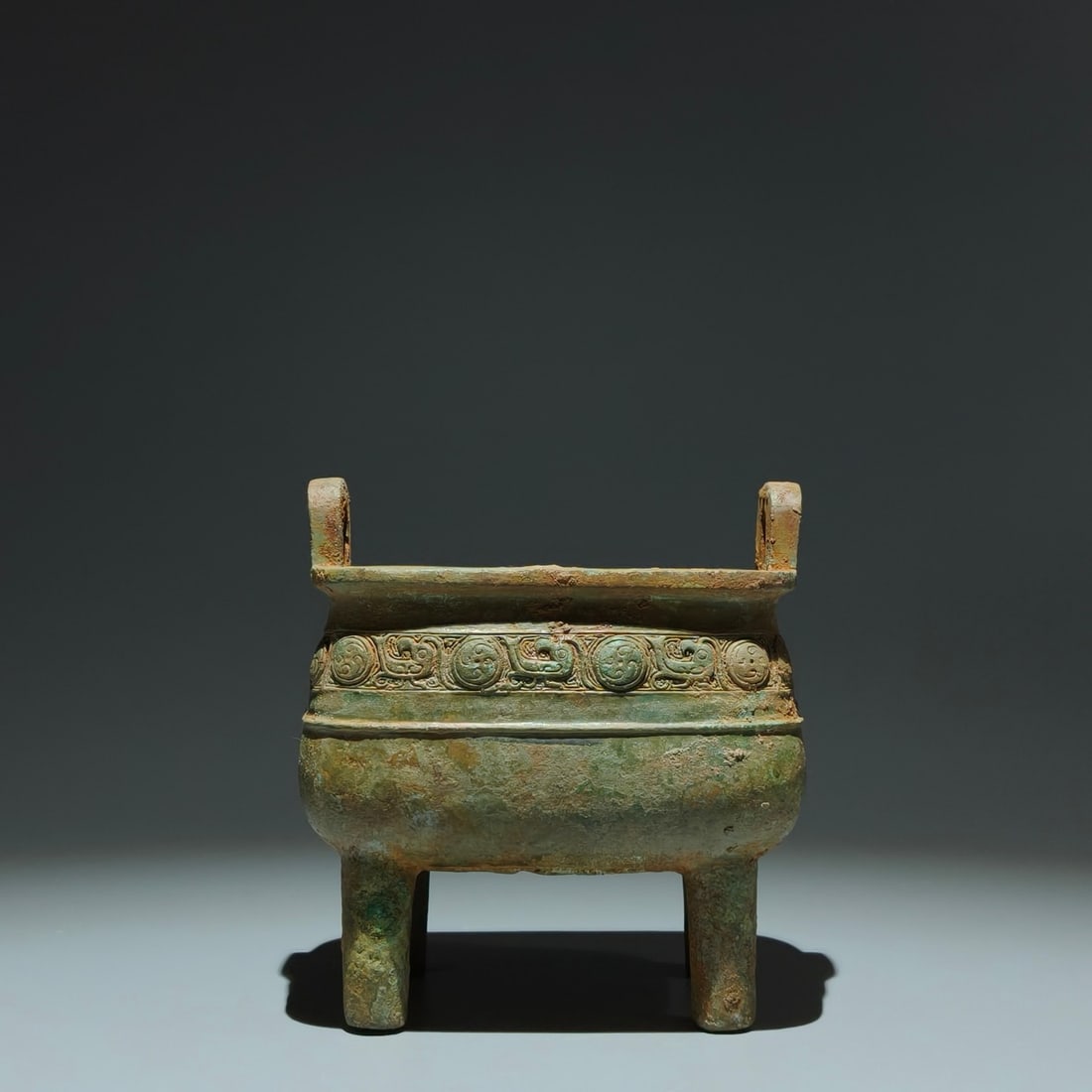 An Archaic Bronze Phoenix Pattern Double-Ears Censer: An Archaic Bronze Phoenix Pattern Double-Ears Censer,Shang Dynasty,China,Size:5.9inx5.7inx3.9in 青铜凤纹双耳香炉,中国商代