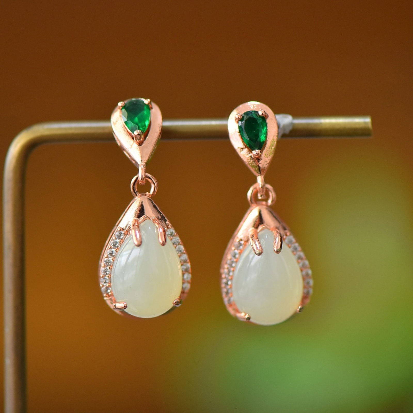 A Pair of Exquisite Bronze Inlaid White Jade Earrings: A Pair of Exquisite Bronze Inlaid White Jade Earrings,Size:0.4inx0.6in 一对铜镶白玉耳环