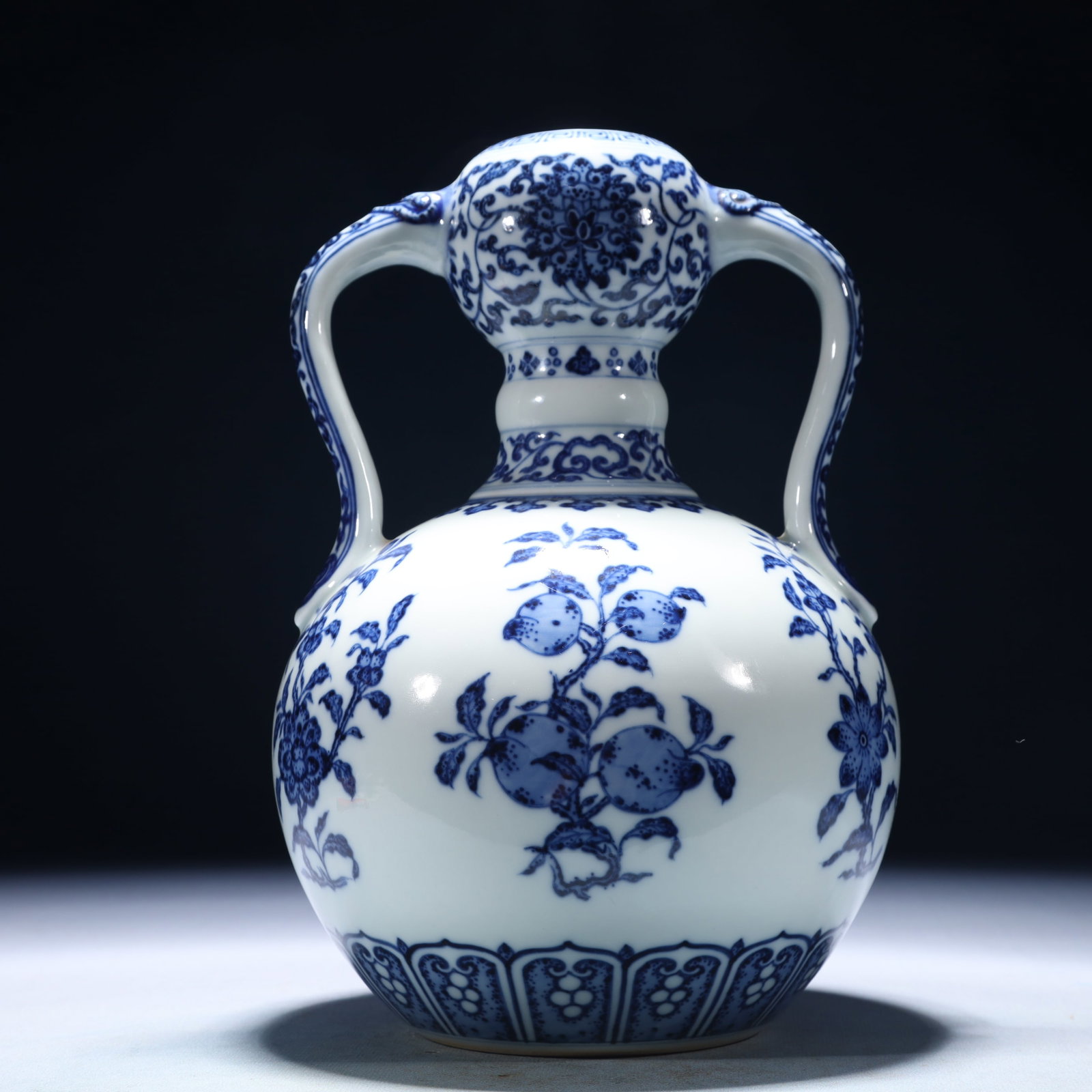 An Exquisite Blue and White Flower and Fruit Pattern Double-Ears Vase: An Exquisite Blue and White Flower and Fruit Pattern Double-Ears Vase,Qing Dynasty,China,Yongzheng Six-character Mark,Size:6.3inx9.8in,Weight:1500g 青花花果纹双 