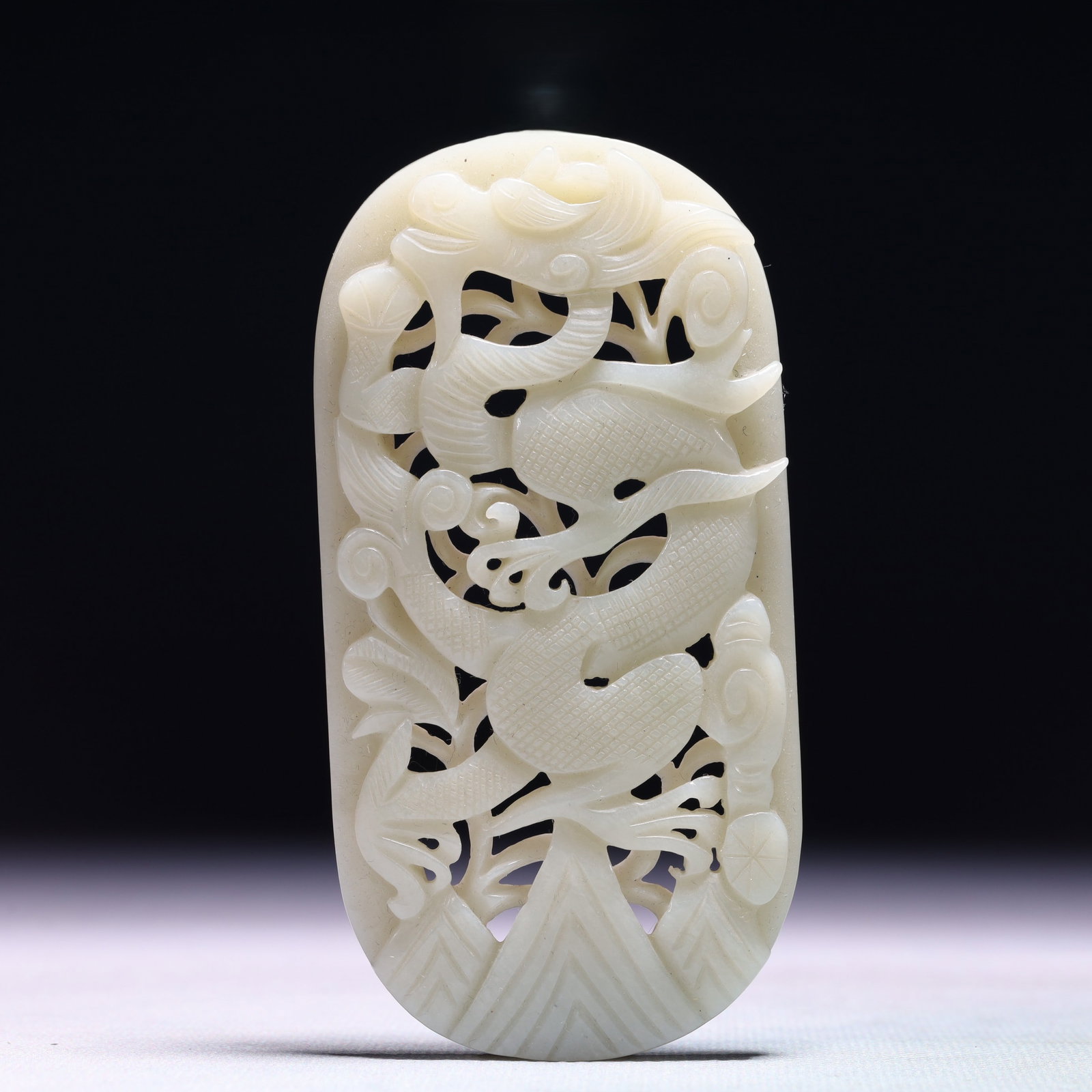 An Exquisite White Jade Auspicious Cloud and Dragon Pattern Ornament (1 of 4)