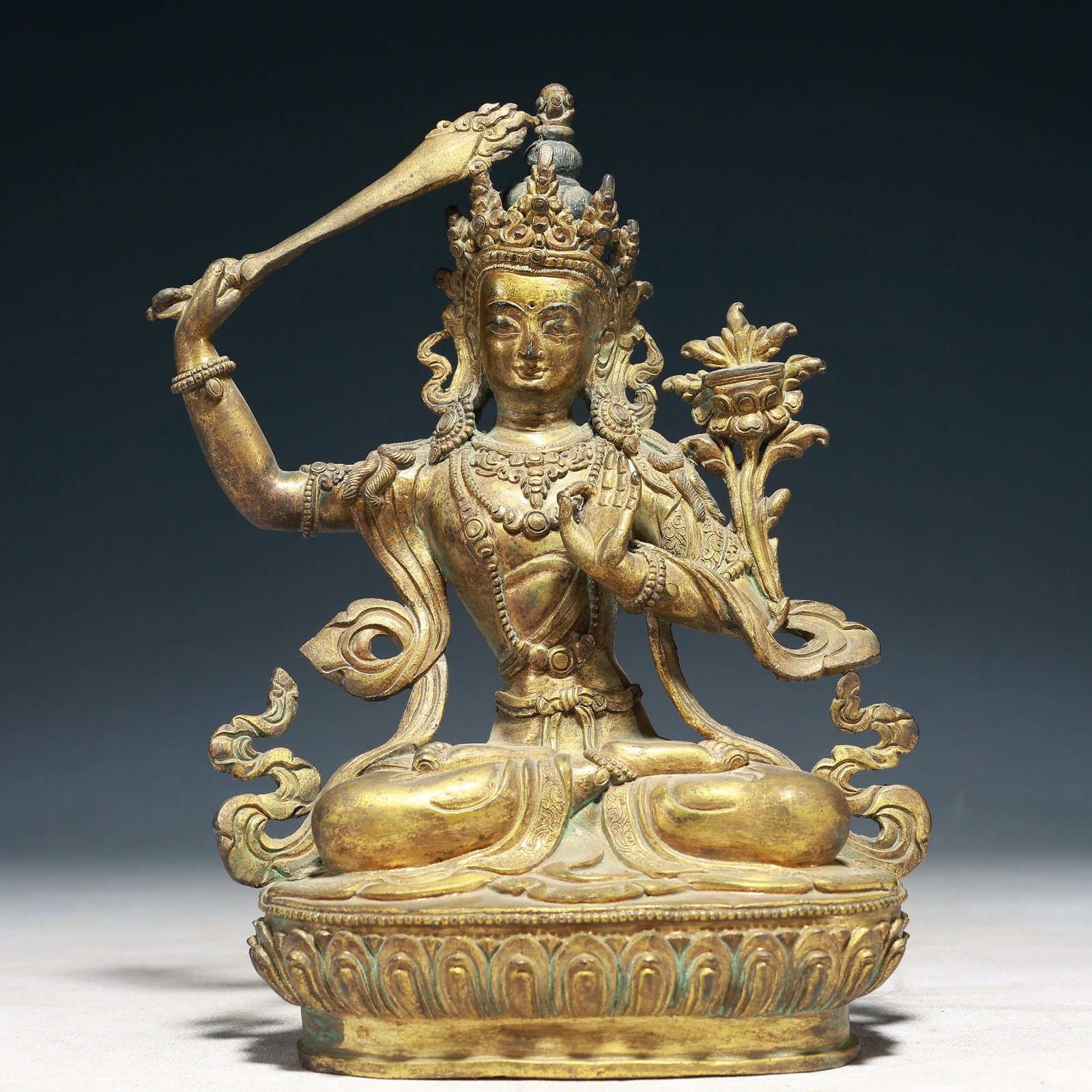 A Solemn Gilt Bronze Statue of Manjusri: A Solemn Gilt Bronze Statue of Manjusri,Qing Dynasty,China,Size:5.9inx3.1inx9.1in,Weight:1600g 铜鎏金文殊菩萨像,中国清代