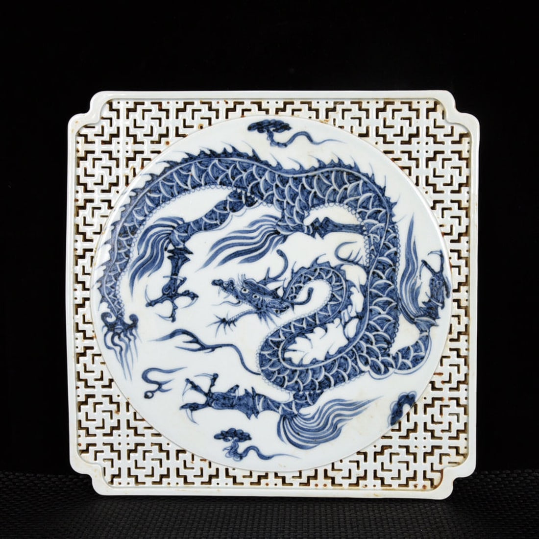 A Rare Blue and White Hollow Dragon Pattern Plate: A Rare Blue and White Hollow Dragon Pattern Plate,Yuan Dynasty,China,Size:1inx11.8inx11.8in 青花镂空龙纹盘子中国元代
