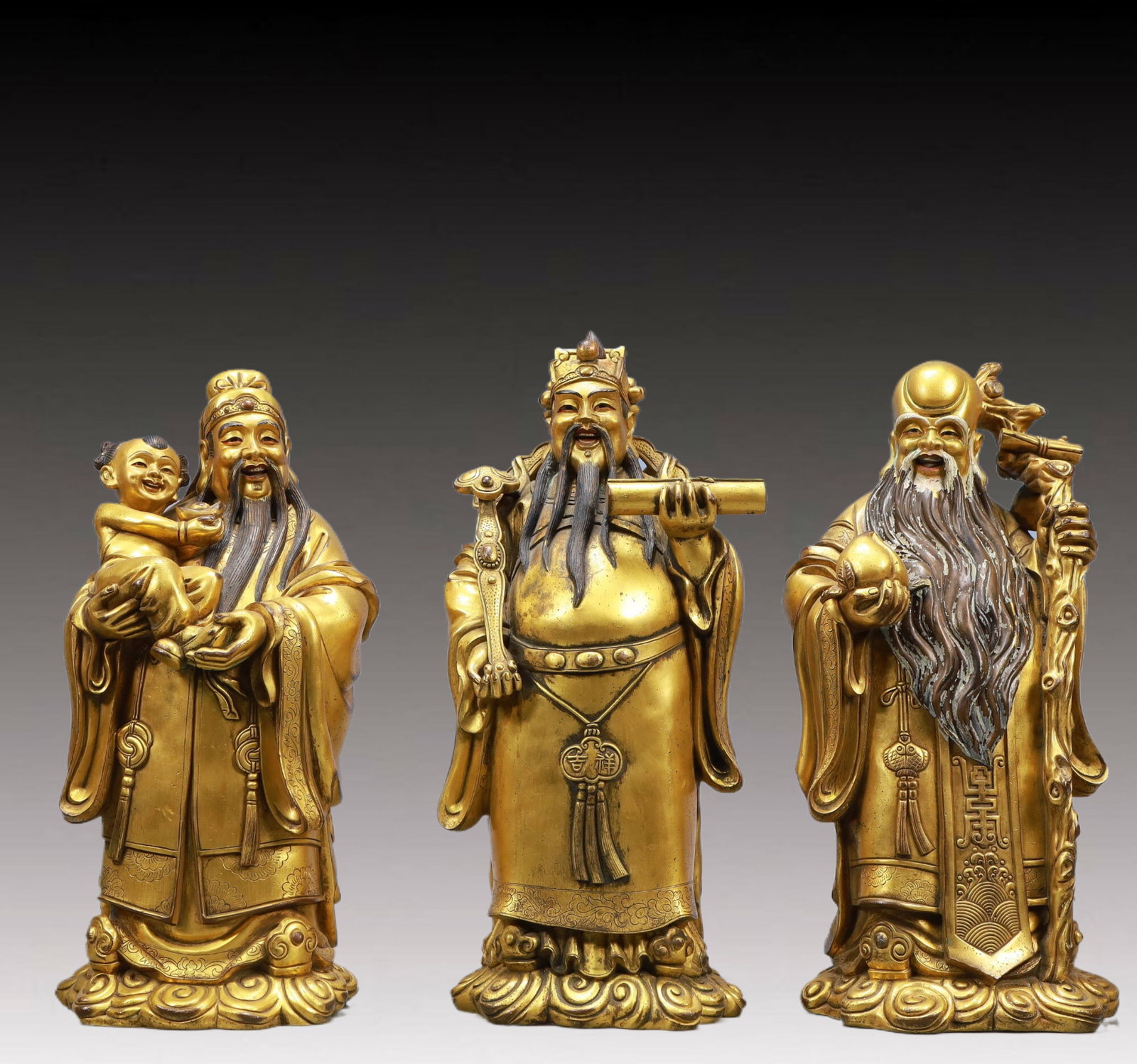 A Set of Solemn Gilt Bronze Statue of Figures: A Set of Solemn Gilt Bronze Statue of Figures ,Ming Dynasty, China,Size:6.7inx4.7inx13.8inWeight:23150g 一套铜鎏金福禄寿人物像,中