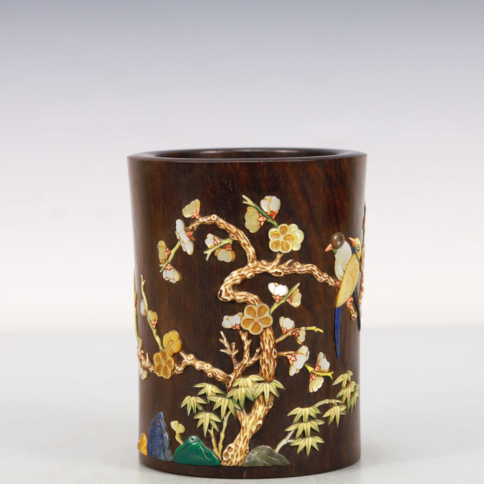 A Zitanwood Gem-Inlaid 'Flower& Bird' Brush Pot: A Zitanwood Gem-Inlaid 'Flower& Bird' Brush Pot. Of a cylindrical shape,inlaid in polychrome with birds perched on branches bearing flowers,all surrounded by bamboo. Chinese Qing Dynasty. Size:4.1inx5