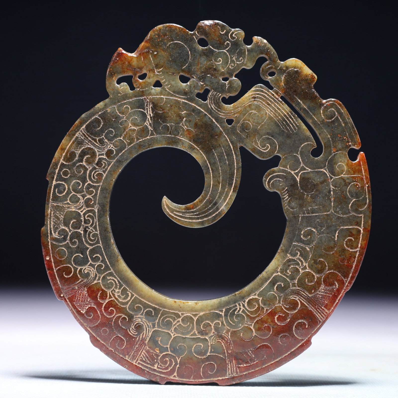 An Exquisite White Jade Auspicious Cloud Pattern Pendant: An Exquisite White Jade Auspicious Cloud Pattern Pendant,Ancient Time,China,Size:4.9inx5.5in,Weight:165.5g 白玉祥云纹挂件,中国远古