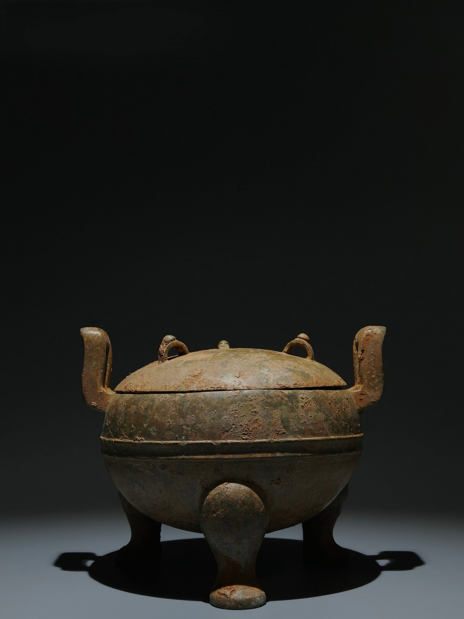 An Archaic Bronze Double-Ears and Tripod Censer: An Archaic Bronze Double-Ears and Tripod Censer,Han Dynasty,China,Size:7.1inx8.9inx7.5in 青铜双耳三足香炉,中国汉代